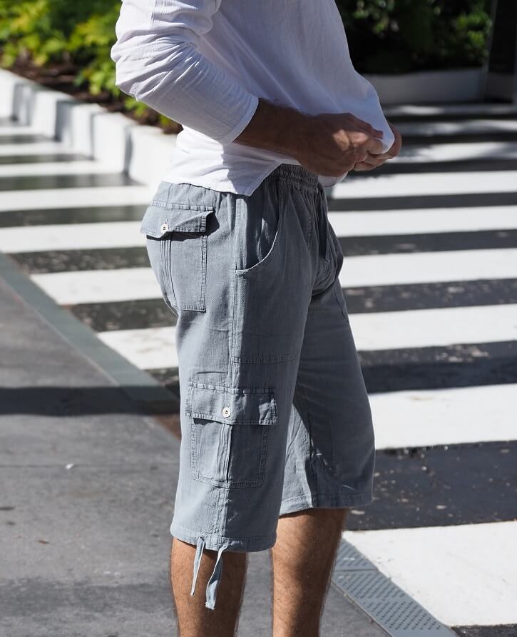Person wearing light gray cargo shorts on a zebra crossing