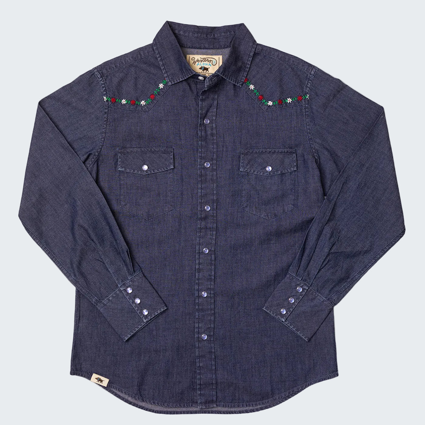 Blue denim shirt with embroidered details on a white background