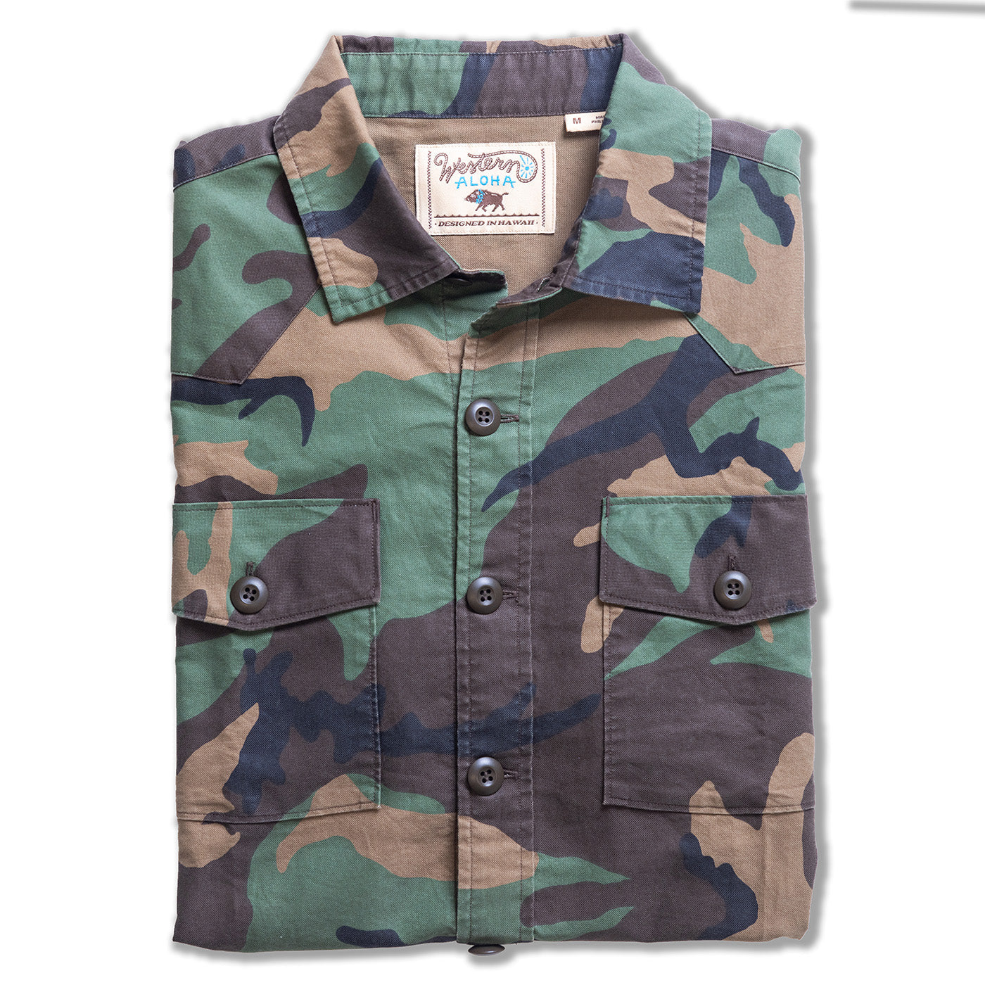 Camouflage shirt with button details on a white background