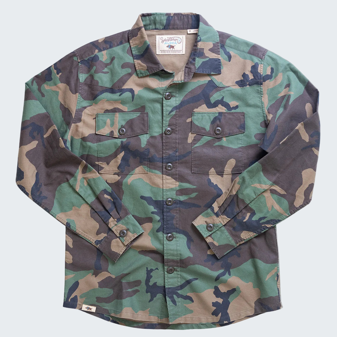 Camouflage shirt with button details on a white background