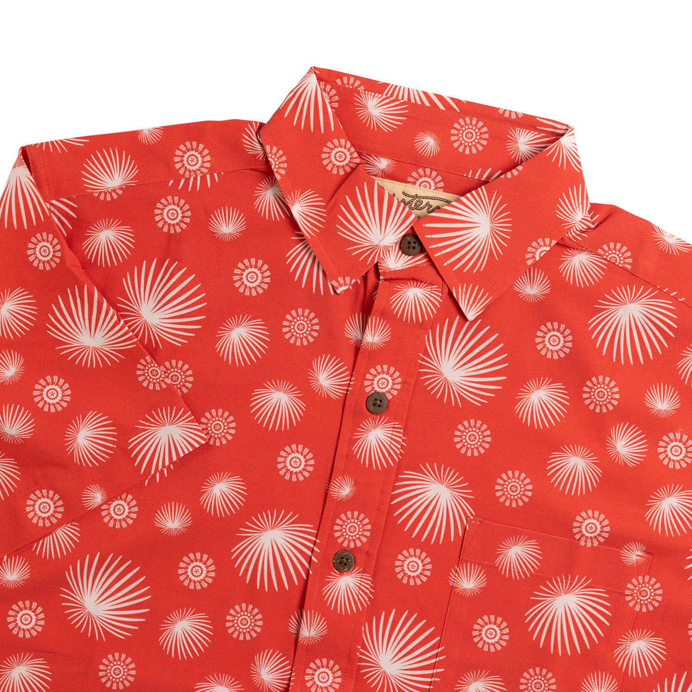 Red shirt with white floral pattern on a white background