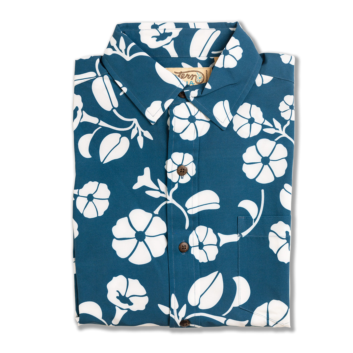 Folded blue shirt with white floral pattern on a white background