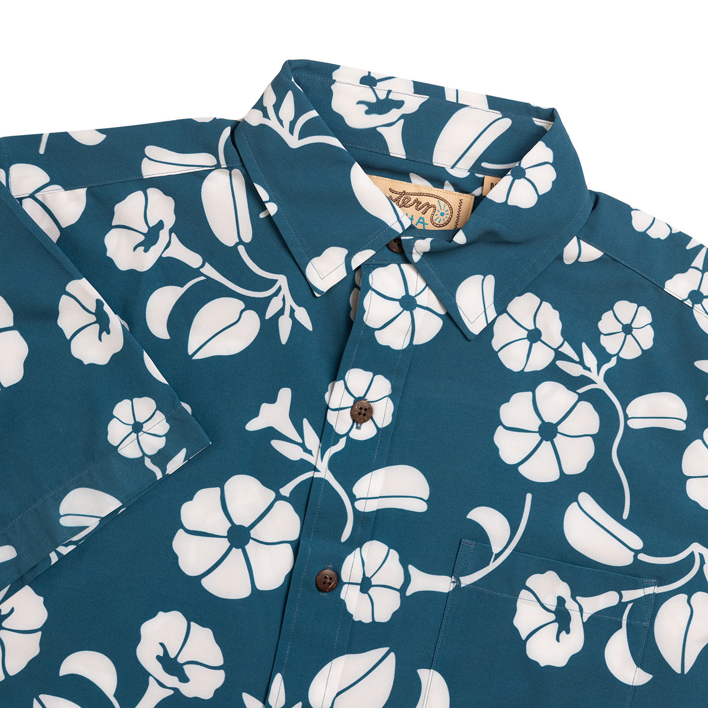 Blue shirt with white floral pattern on a white background
