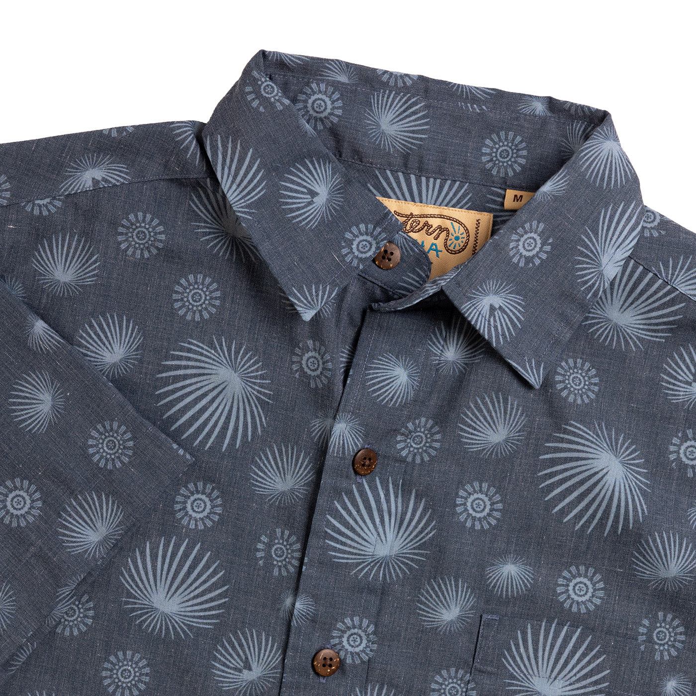 Gray patterned shirt with a brand label on a white background