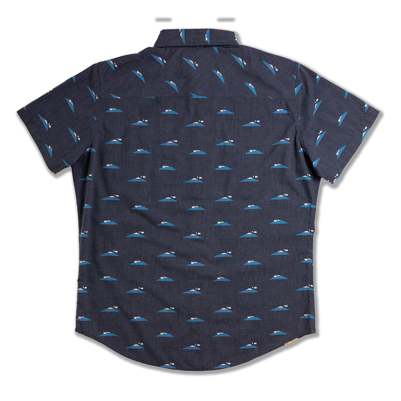 Navy blue shirt with blue whale pattern on a white background