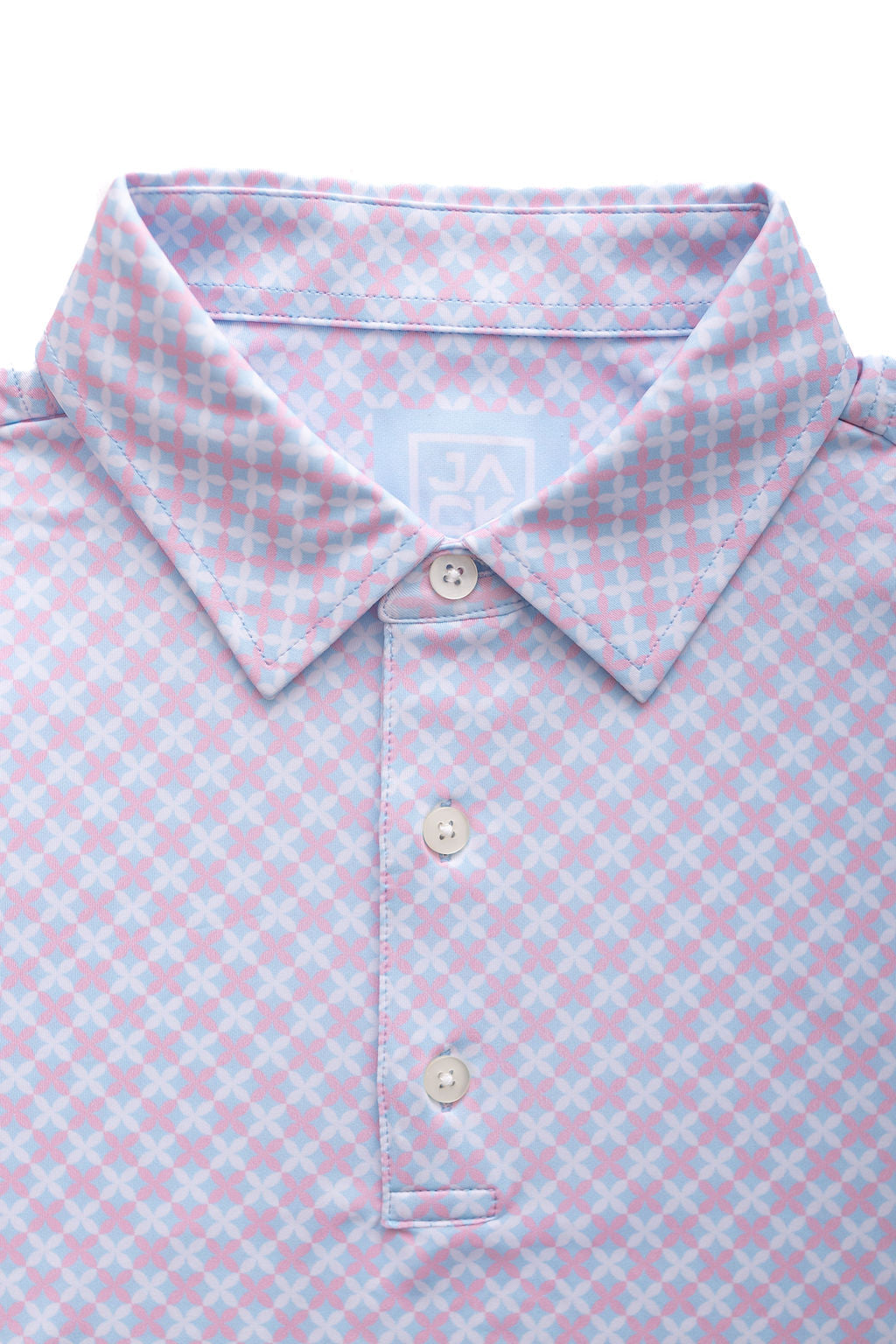 Close-up of a light blue and pink checkered polo shirt with buttons.