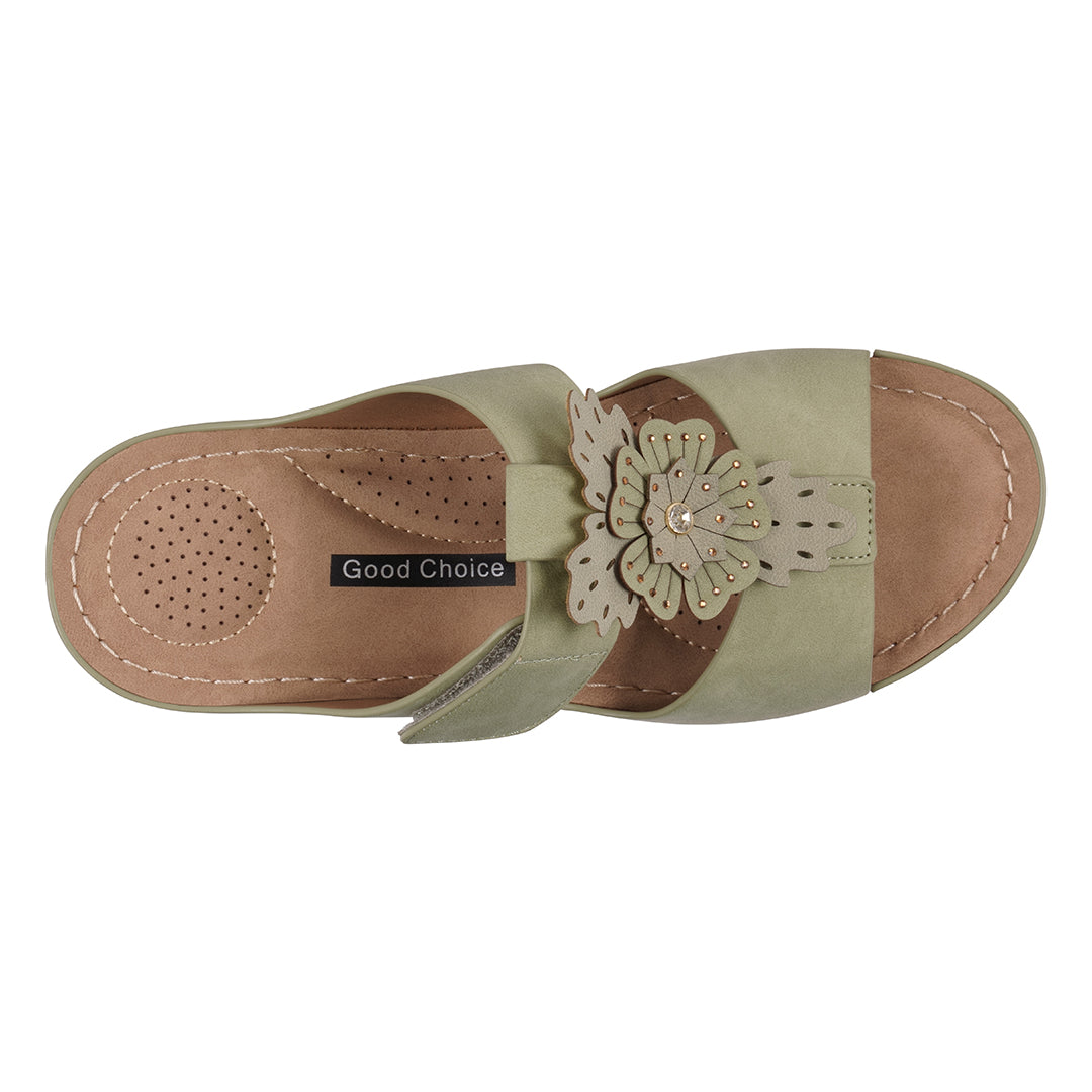 Tan sandal with a decorative flower on a white background