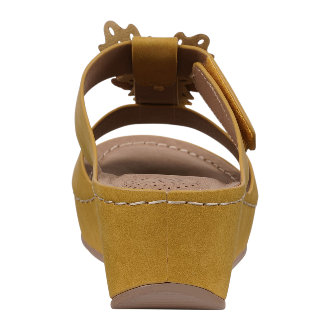 Yellow wedge sandal on a white background