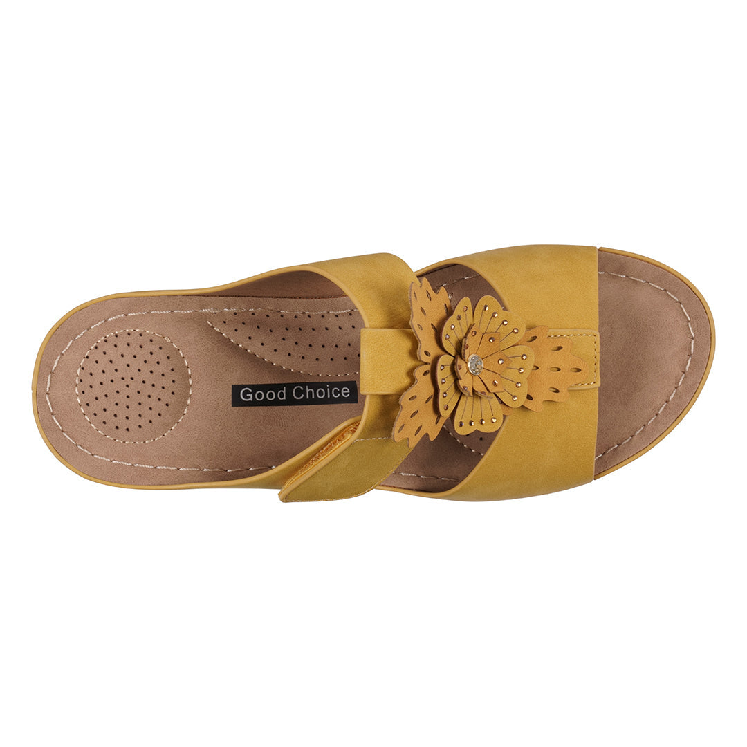 Yellow sandal with butterfly design on a white background