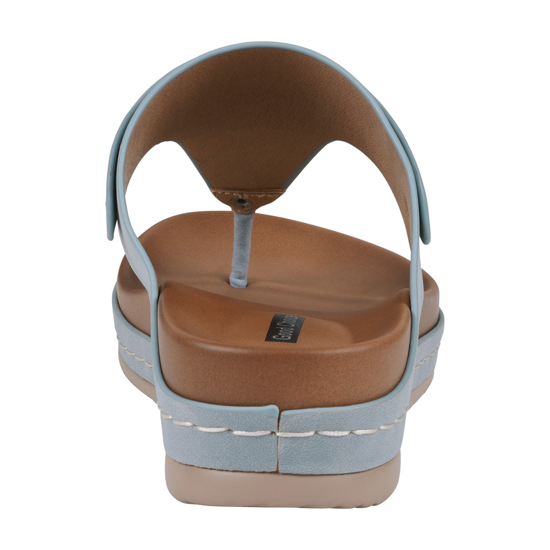 Brown sandal with light blue straps on a white background