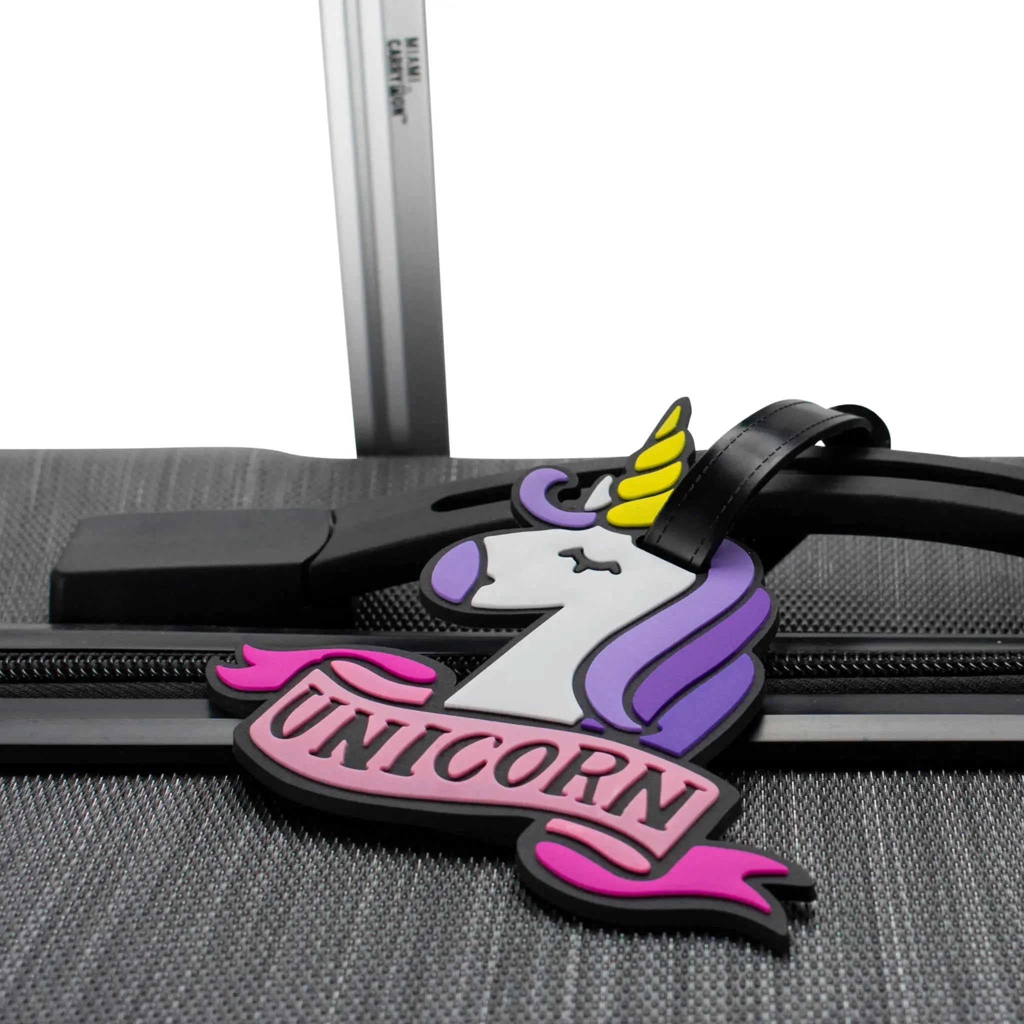 Unicorn-themed luggage tag attached to a suitcase handle
