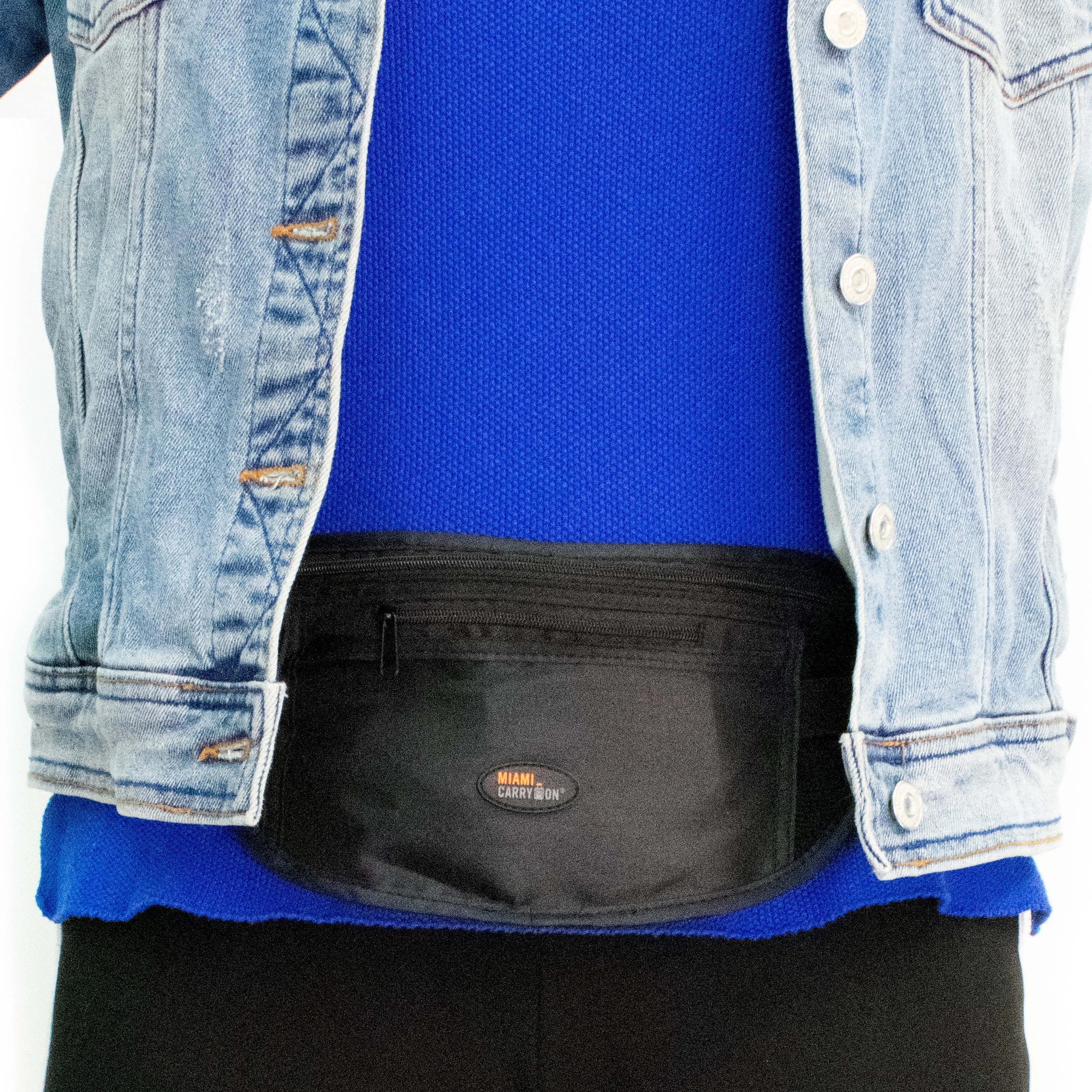 Person wearing a blue shirt, black pants, and a denim jacket with a black pouch.