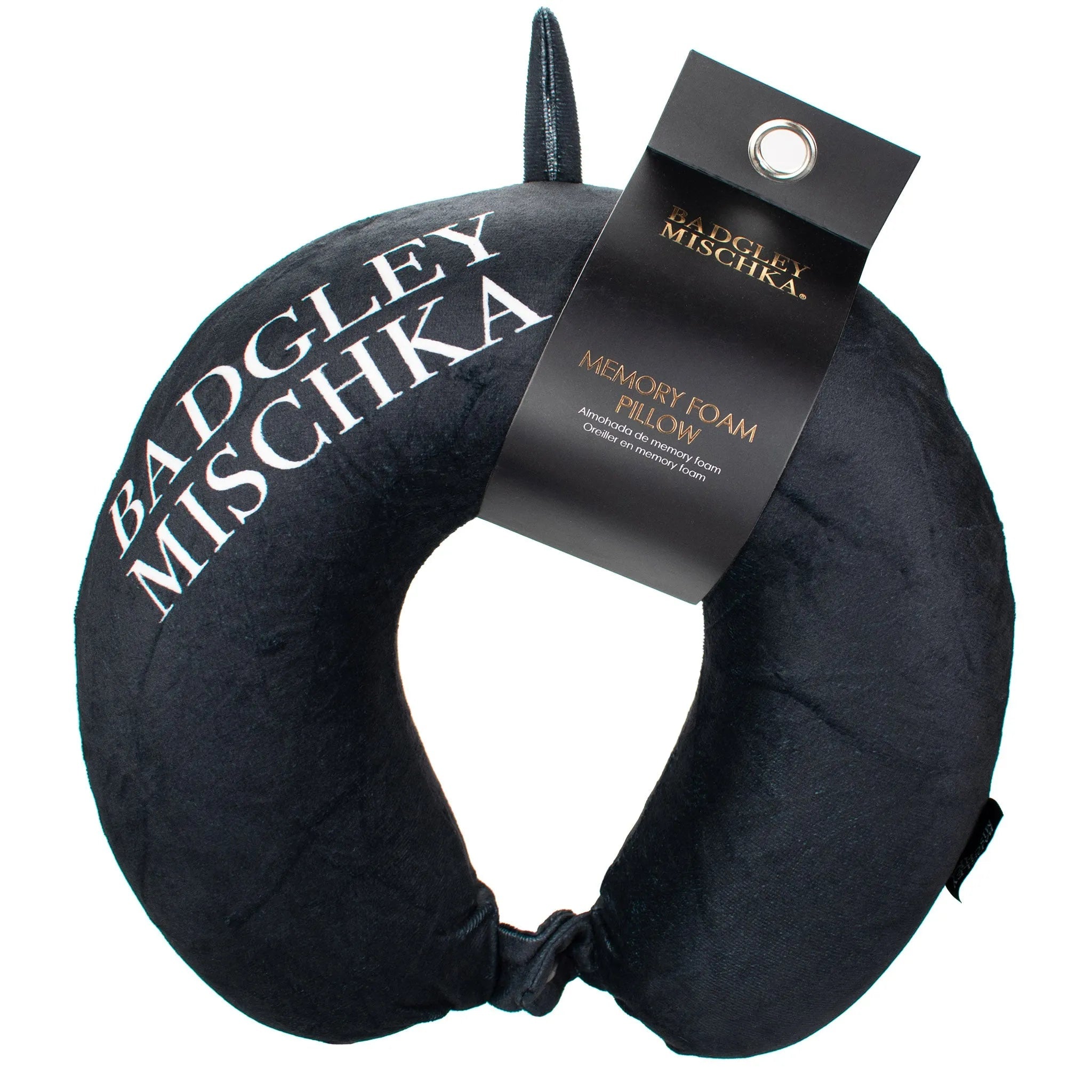 Black neck pillow with 'Badgley Mischka' branding and a visible tag on a white background