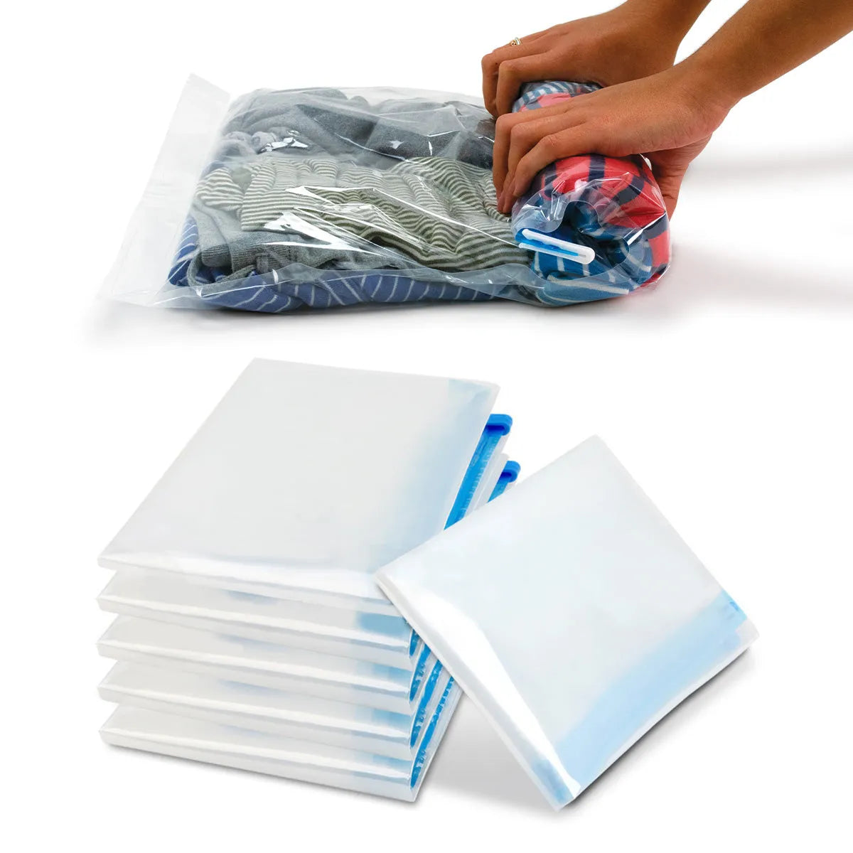 Stack of clear vacuum bags with blue sealing straps on a white surface, with a hand holding a filled bag in the background.