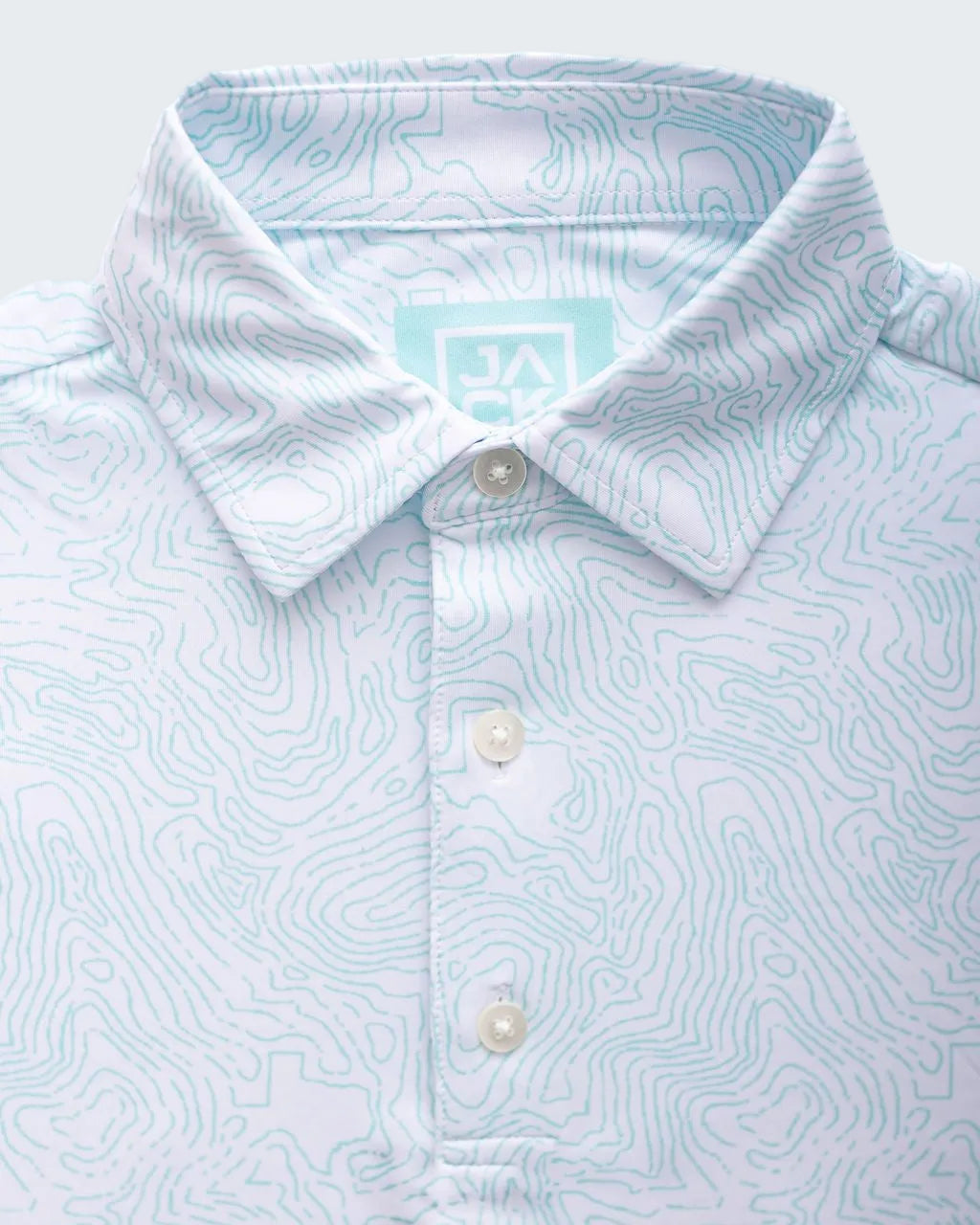 Light blue patterned shirt with a collar and buttons on a white background