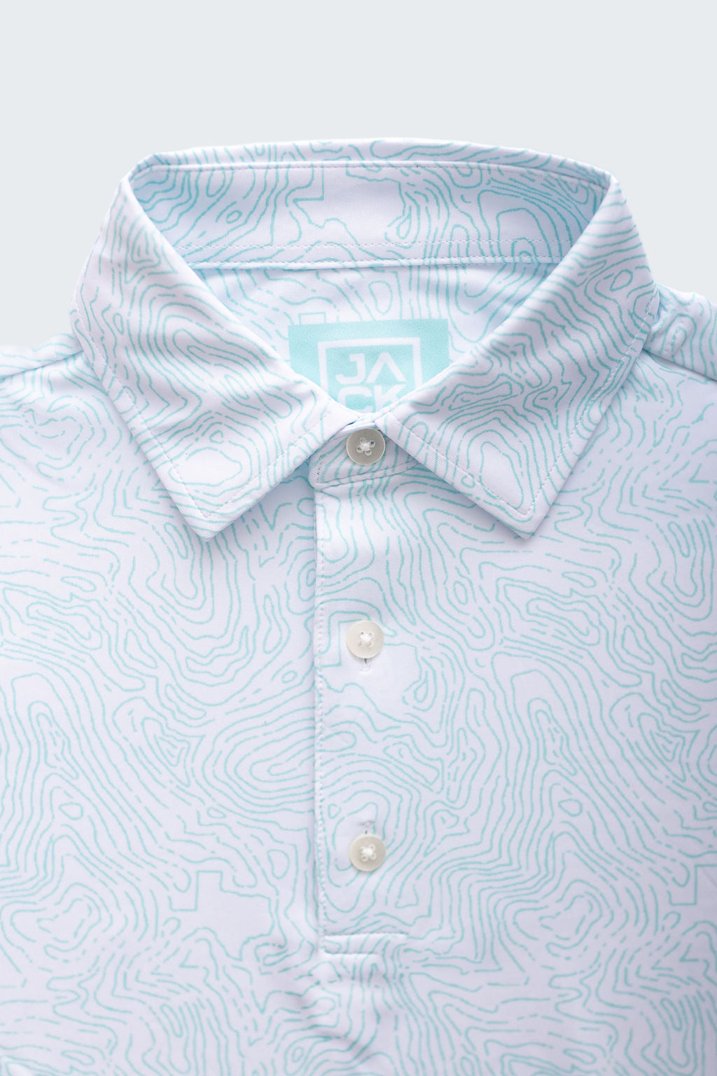Light blue patterned polo shirt with a brand logo on a white background