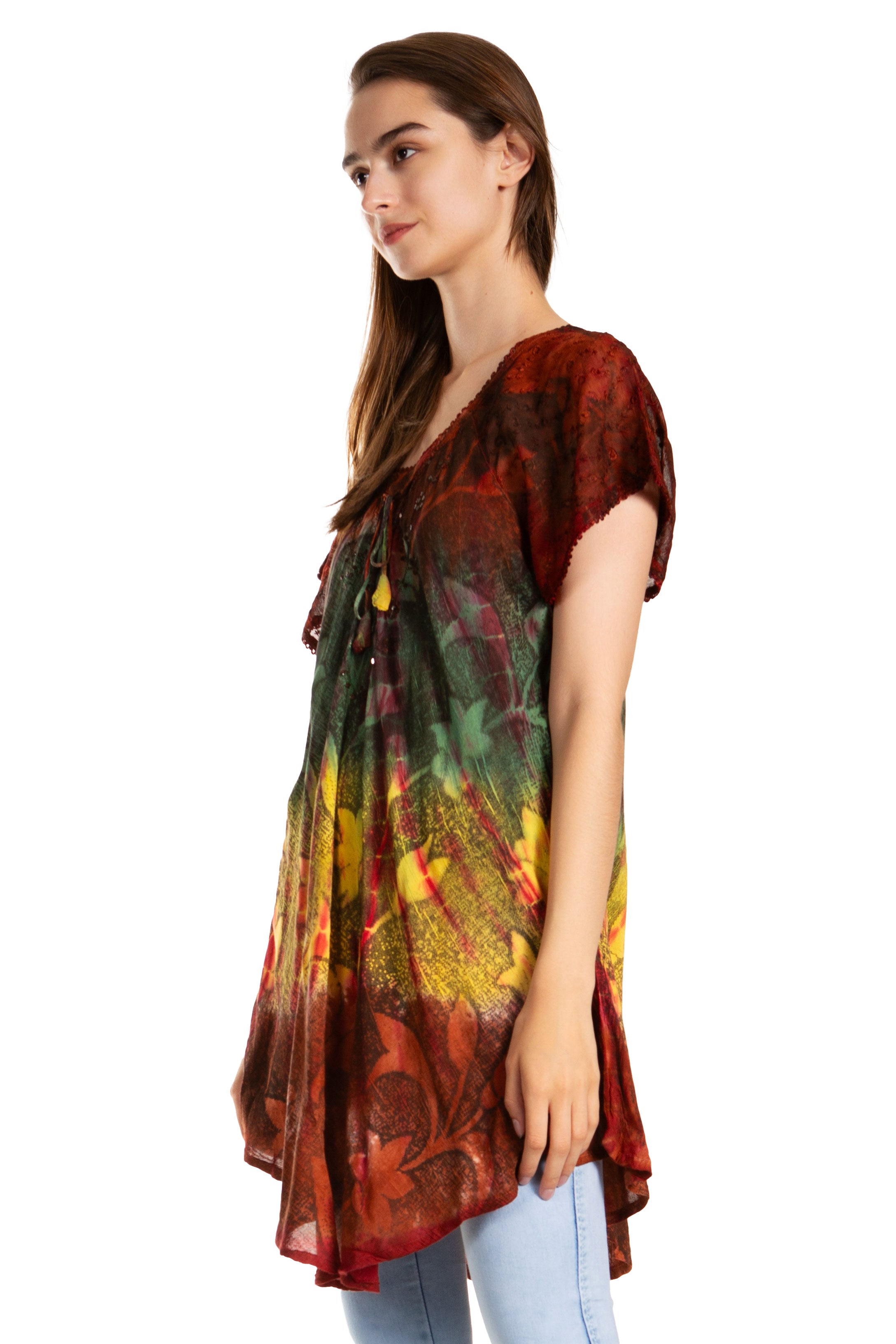 Woman wearing a colorful patterned dress on a white background
