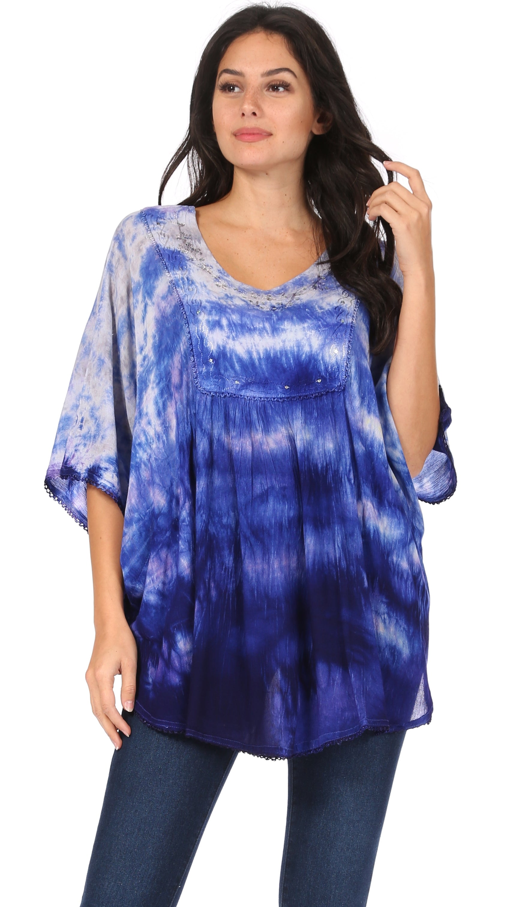 Woman wearing a blue tie-dye top on a white background