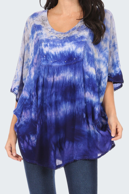 Blue tie-dye shirt worn by a person on a white background