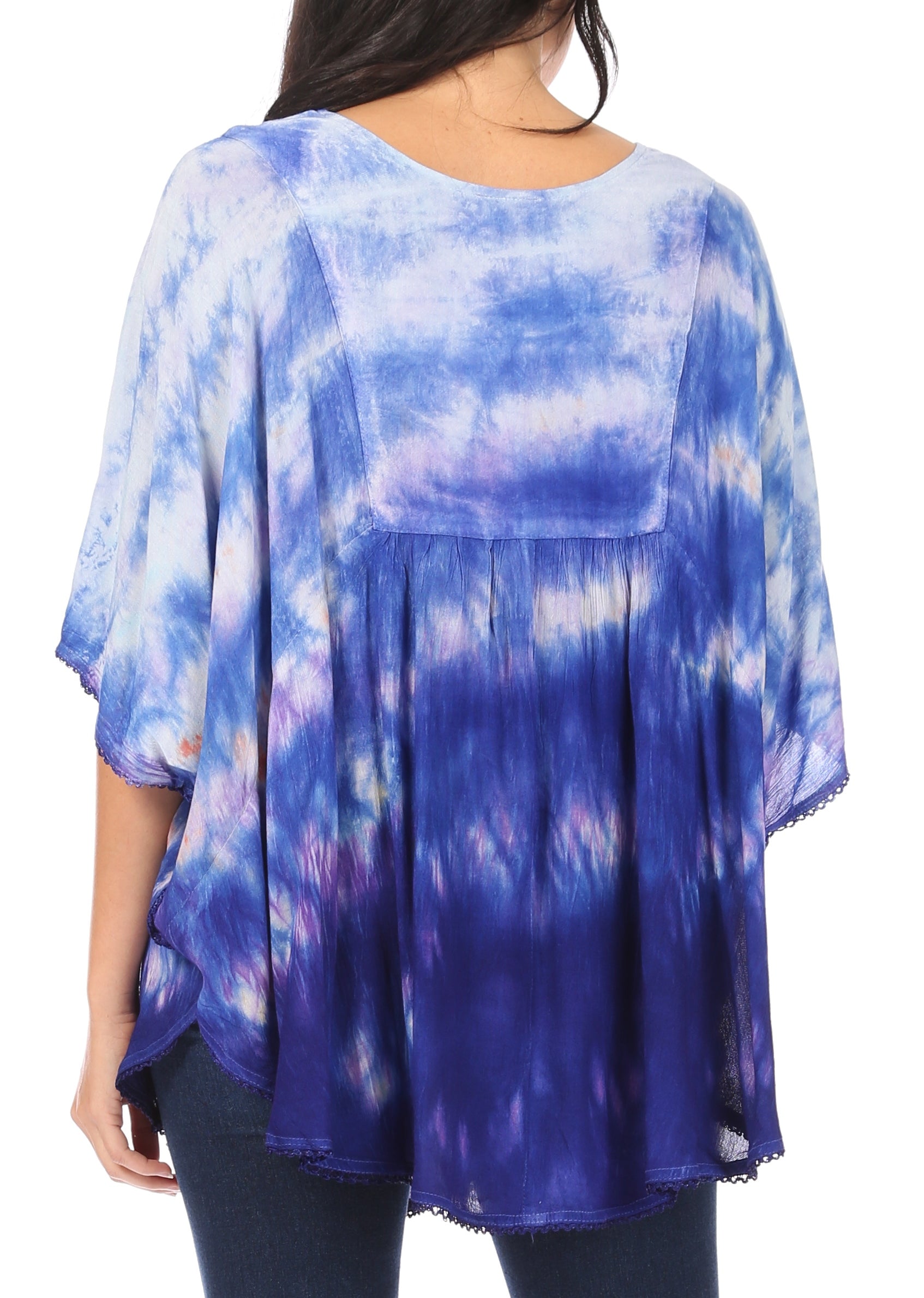 Blue and purple tie-dye top worn by a person on a white background