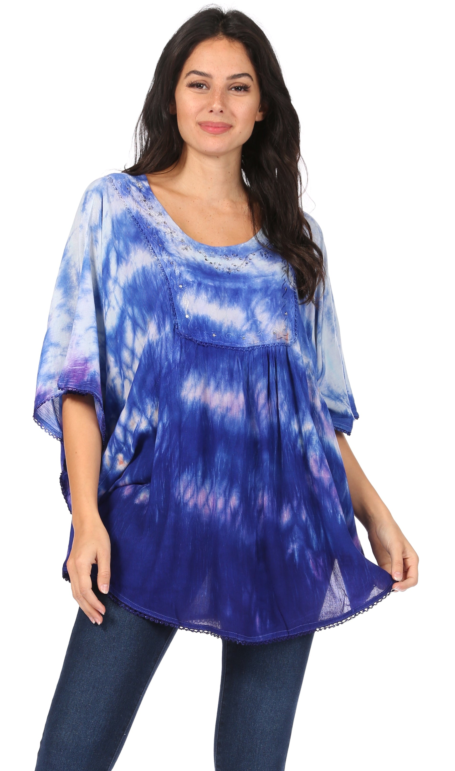 Woman wearing a blue tie-dye top on a white background