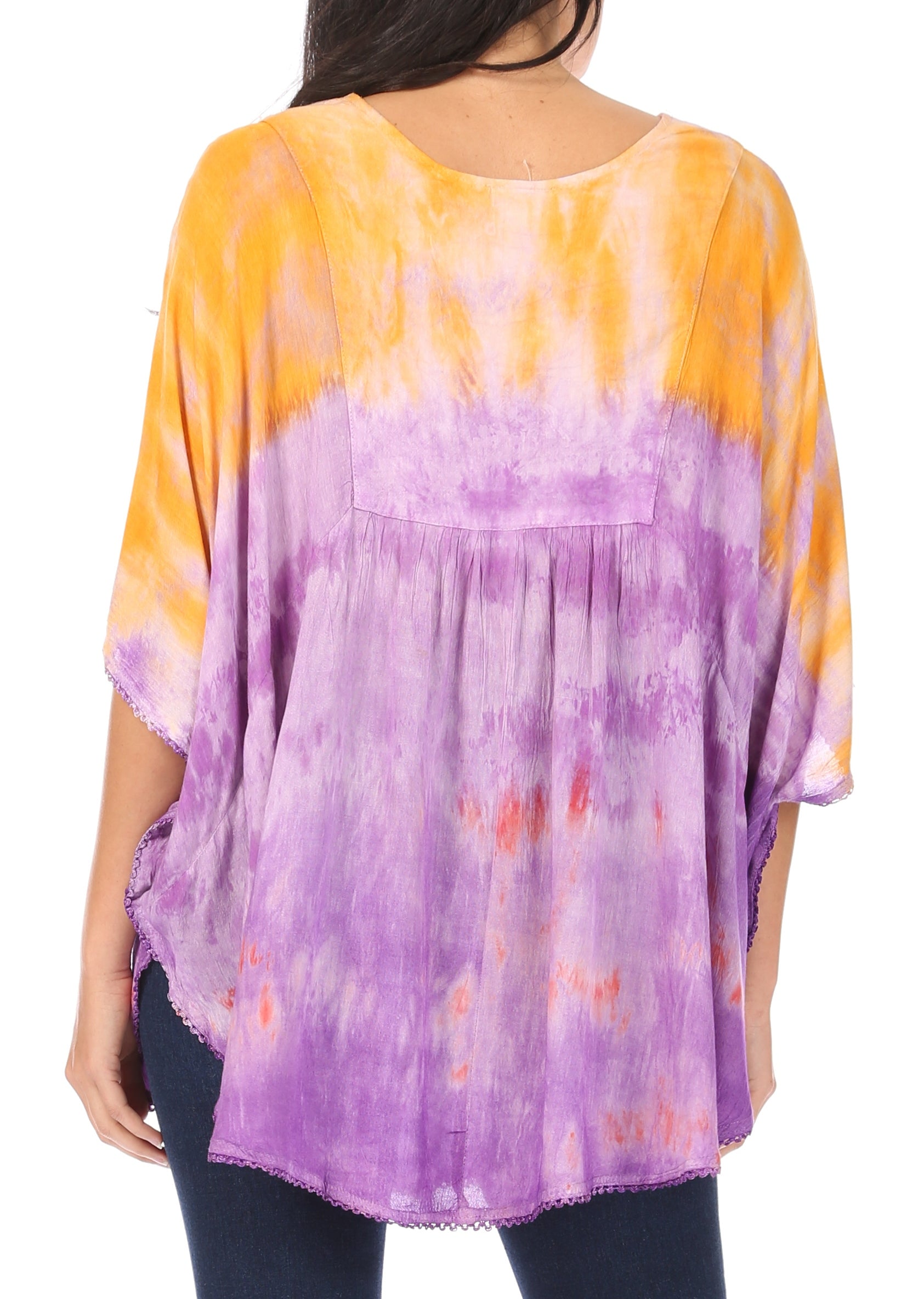 Woman wearing a tie-dye shirt with yellow and purple gradient on a white background