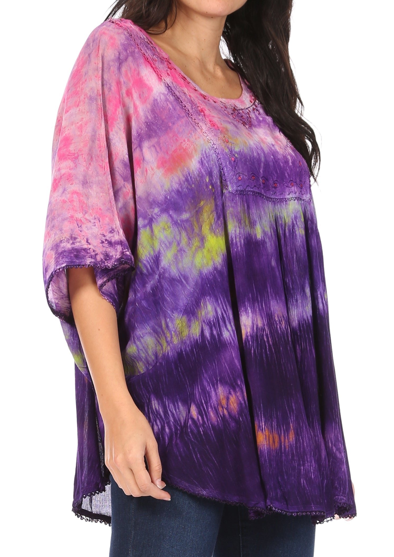 Woman wearing a colorful tie-dye shirt on a white background