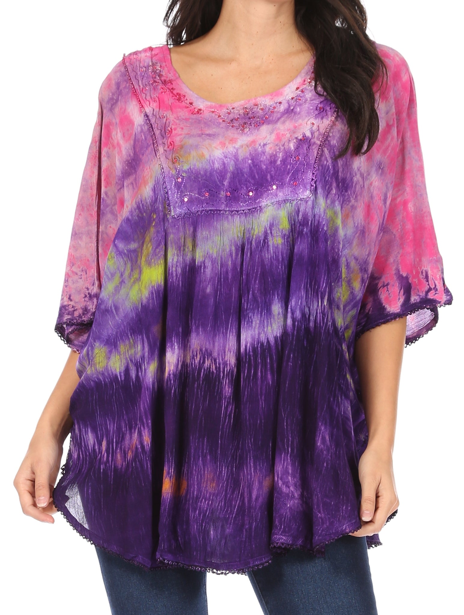 Purple and pink tie-dye top worn by a person on a white background