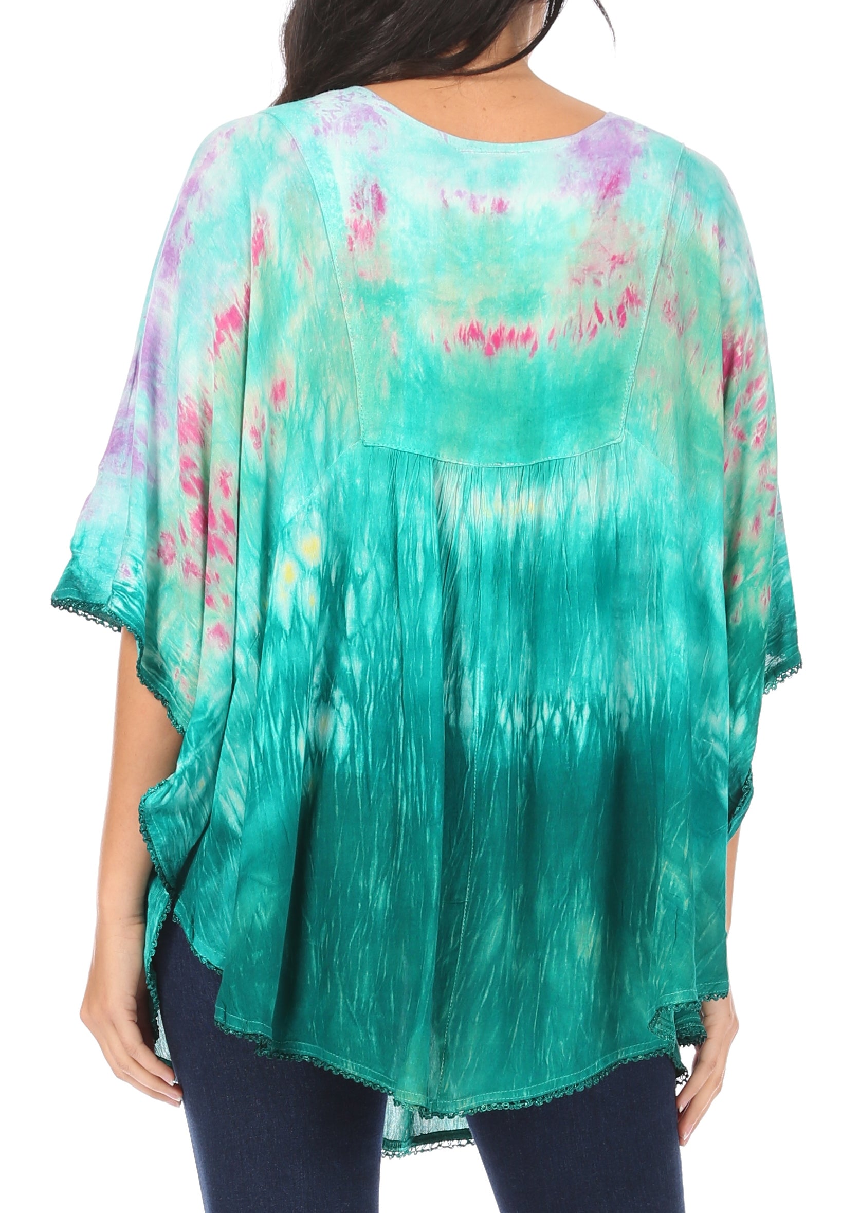 Woman wearing a teal tie-dye blouse with a white background