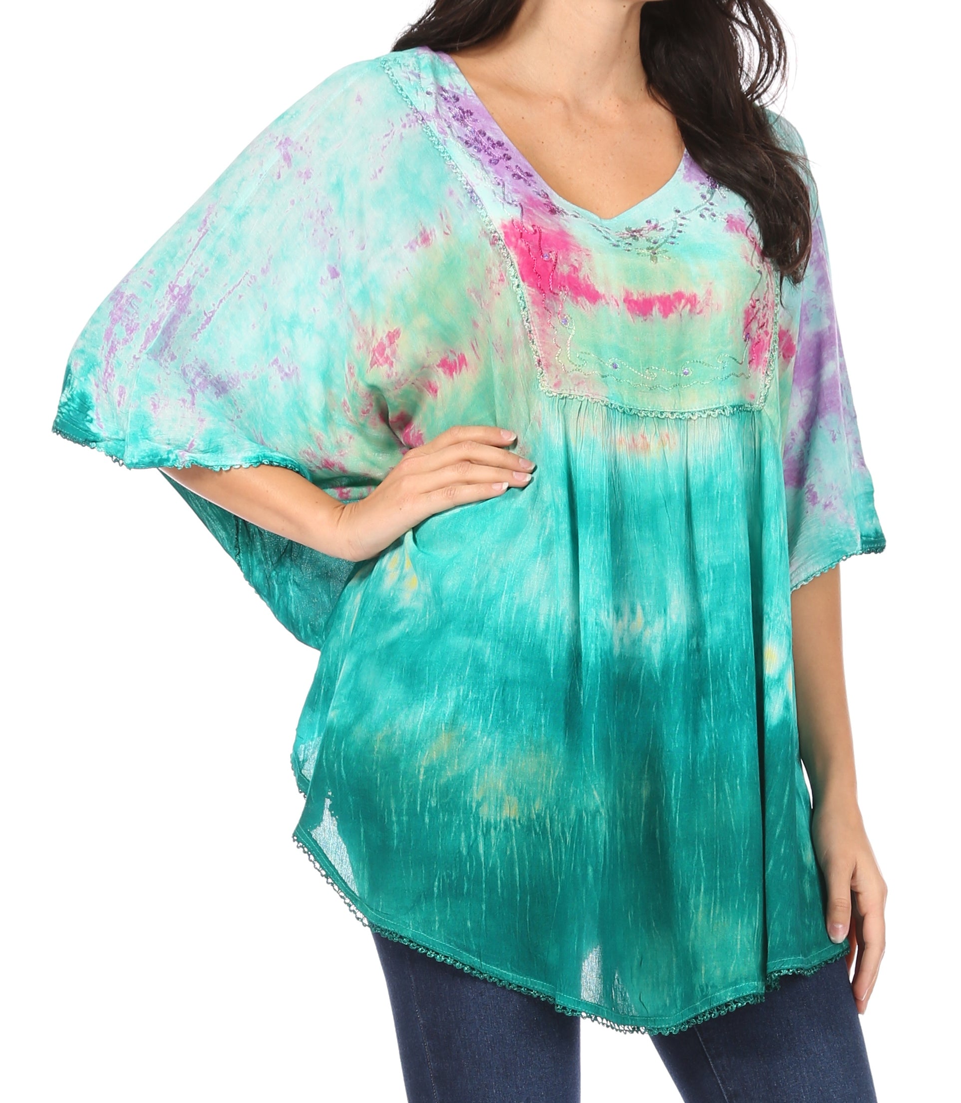 Woman wearing a colorful tie-dye top on a white background