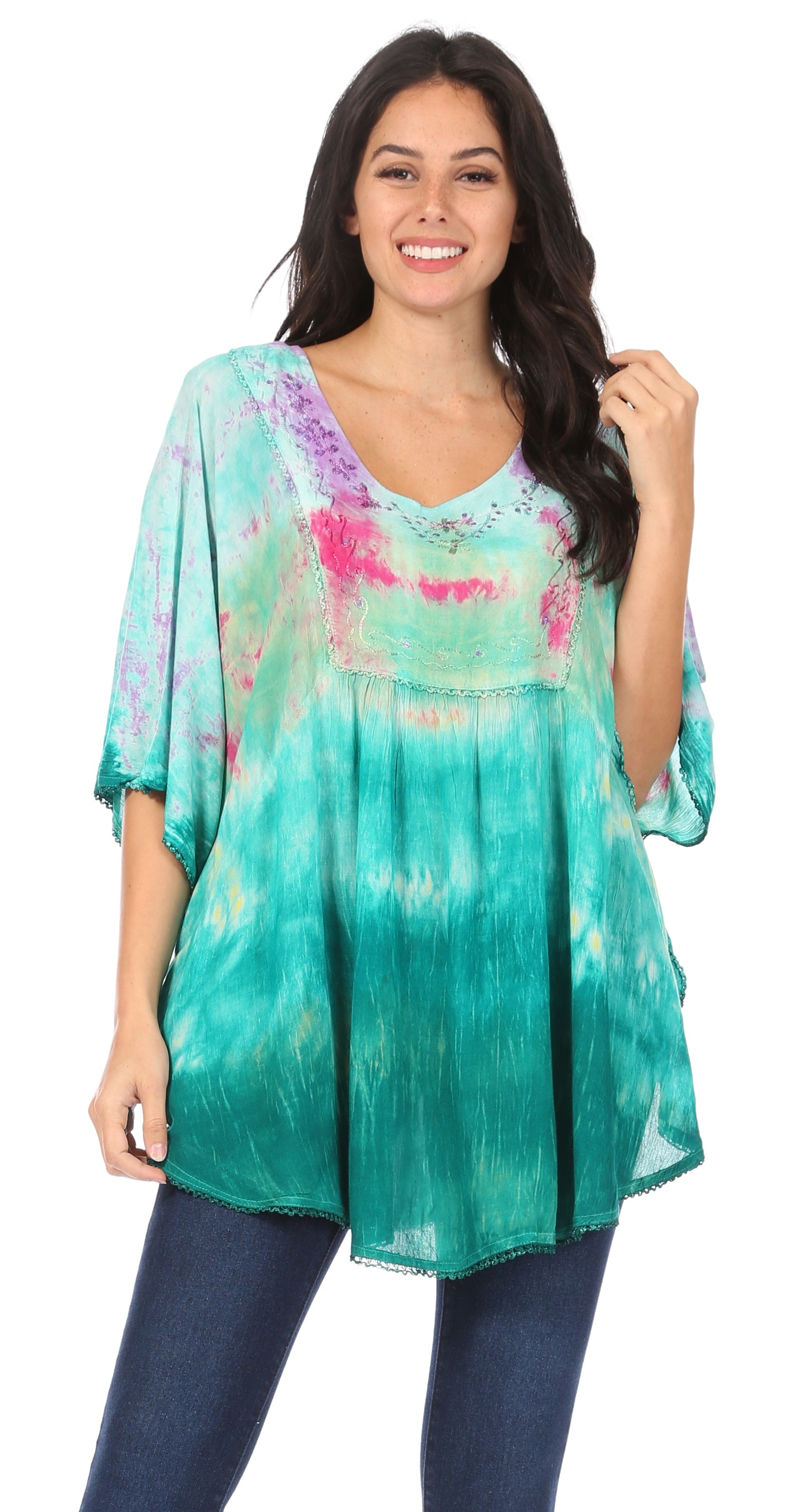 Woman wearing a colorful tie-dye top with a white background