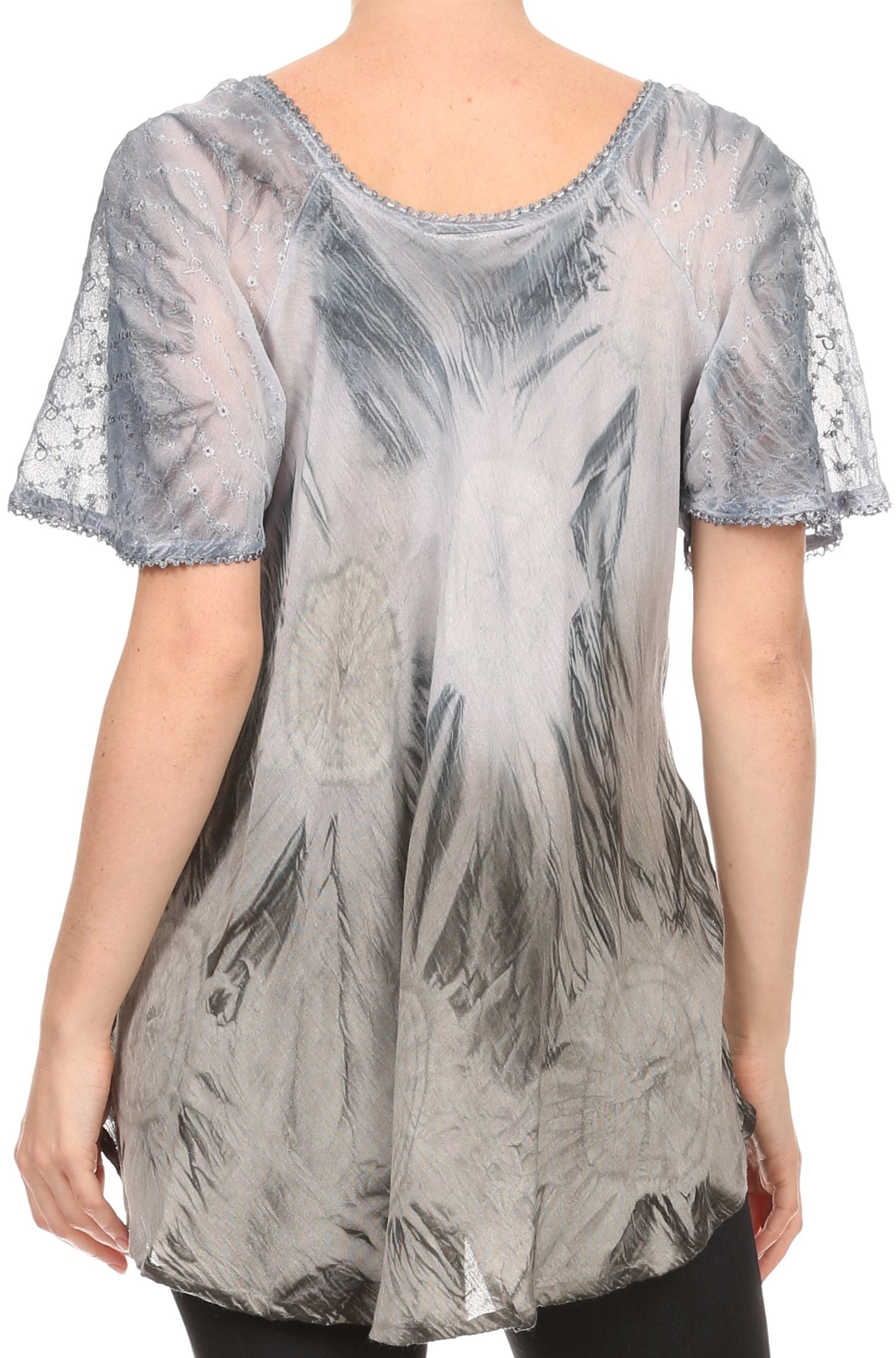 Sheer blouse with abstract pattern worn by a person on a white background