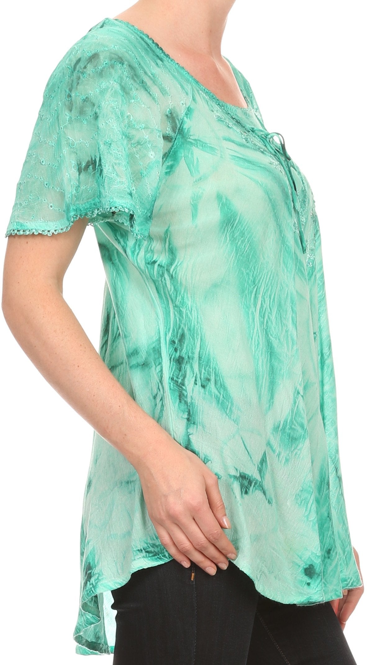 Green marble patterned top worn by a person on a white background