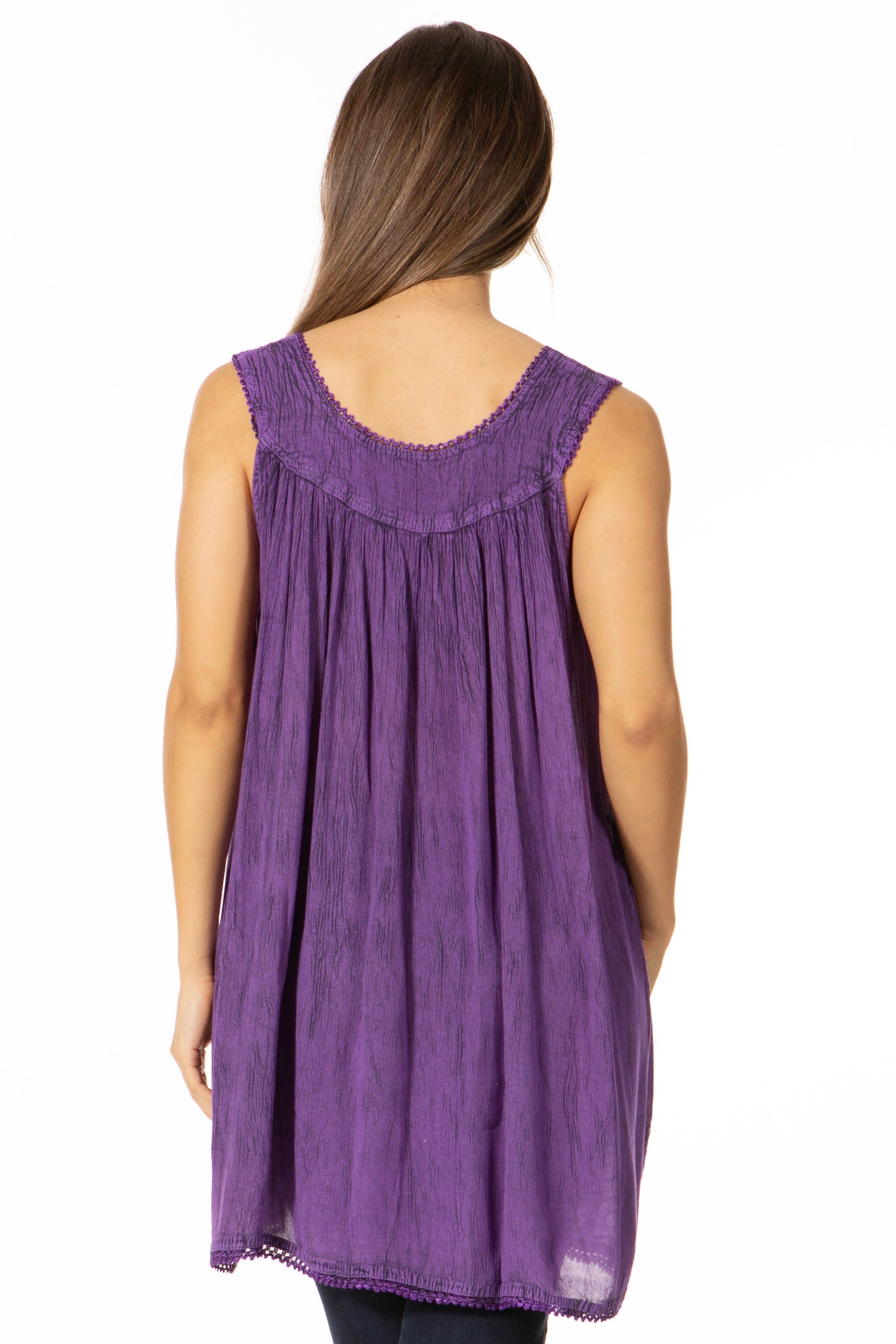 Purple sleeveless top worn by a person on a white background