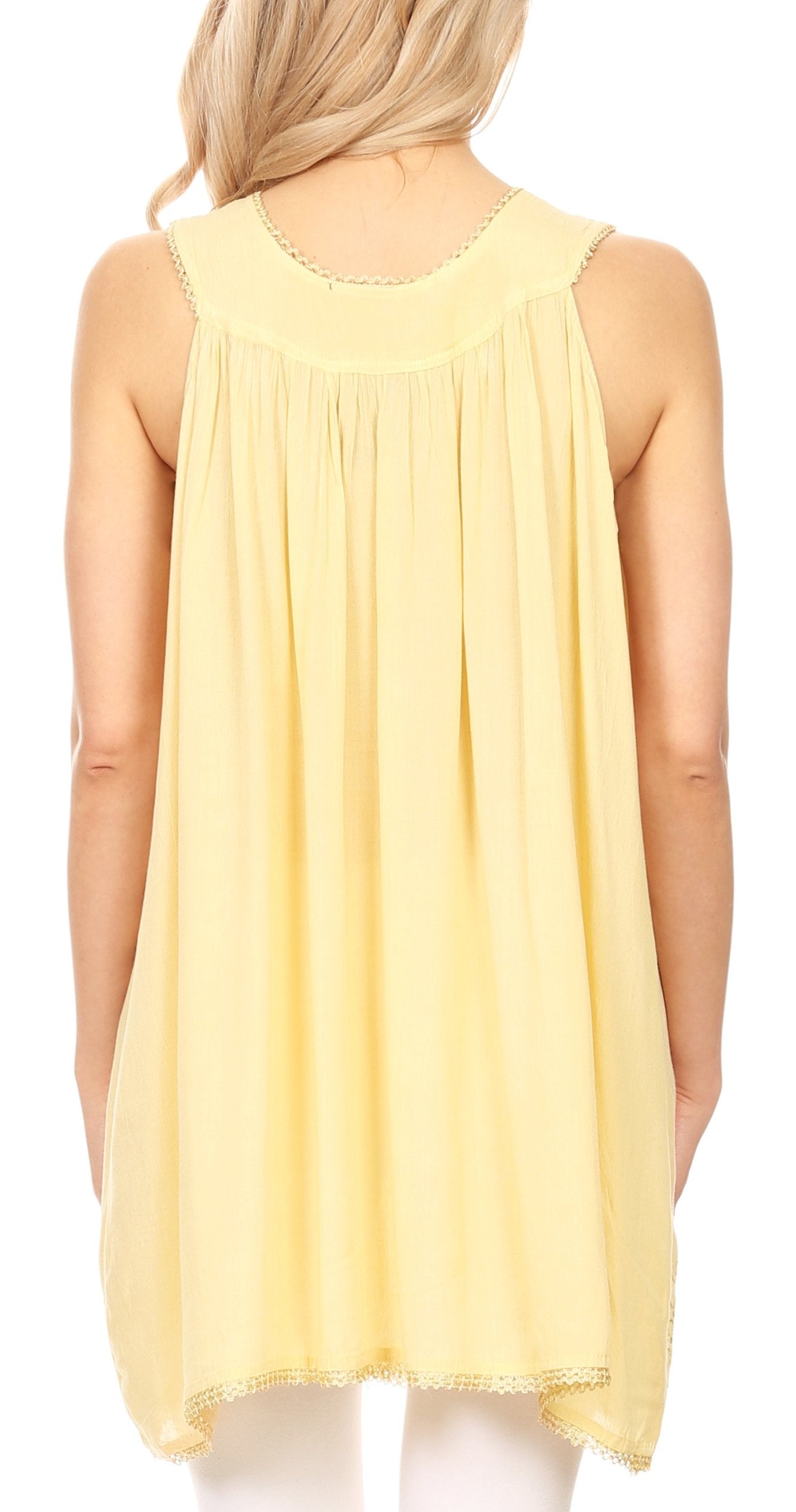 Yellow sleeveless top worn by a person on a white background