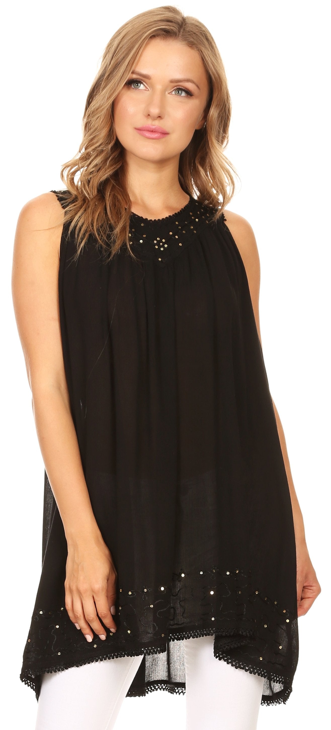 Woman wearing a black sleeveless top with embellishments on a white background