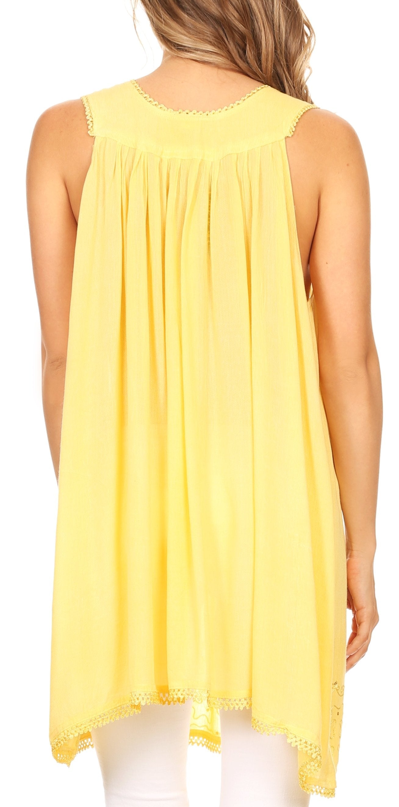 Yellow sleeveless top worn by a person on a white background