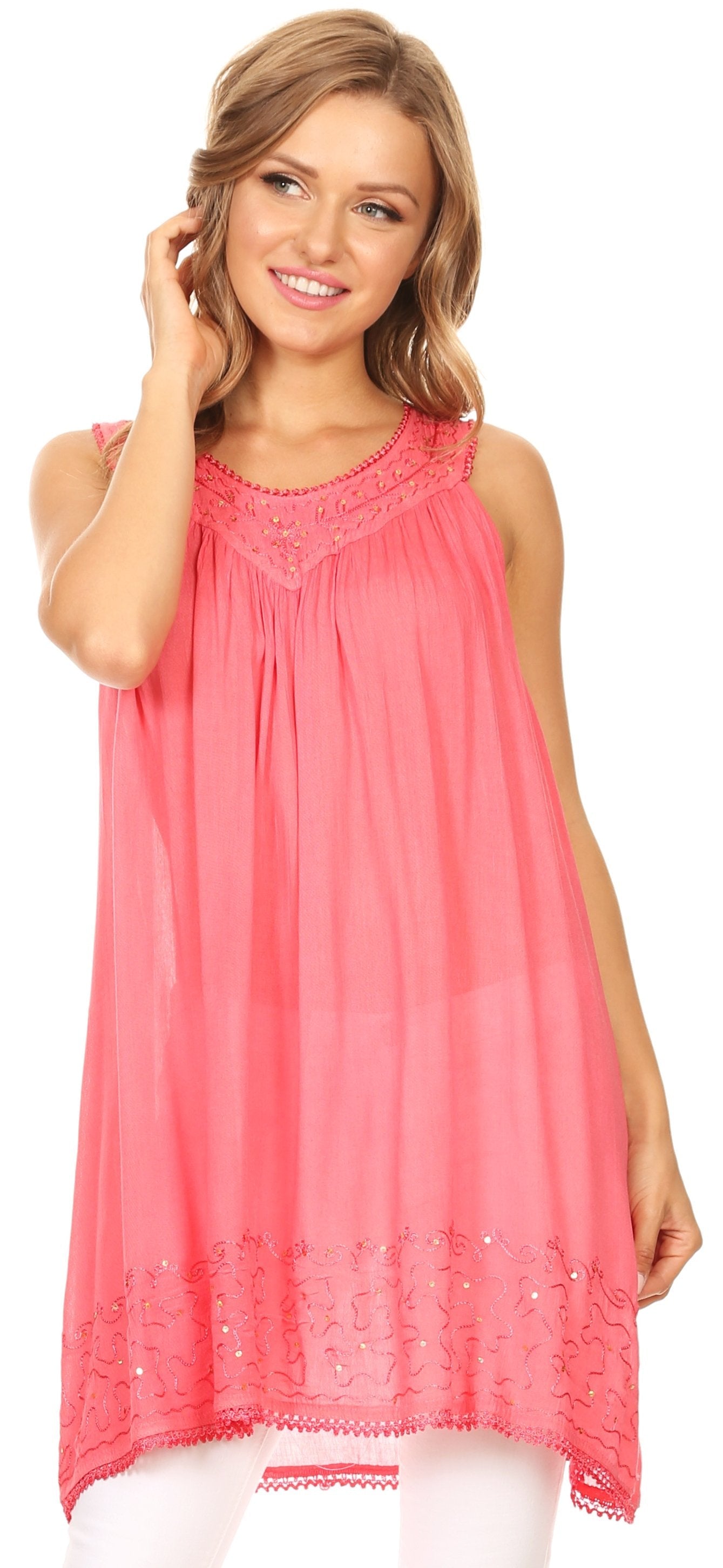 Woman wearing a coral sleeveless top with lace details on a white background