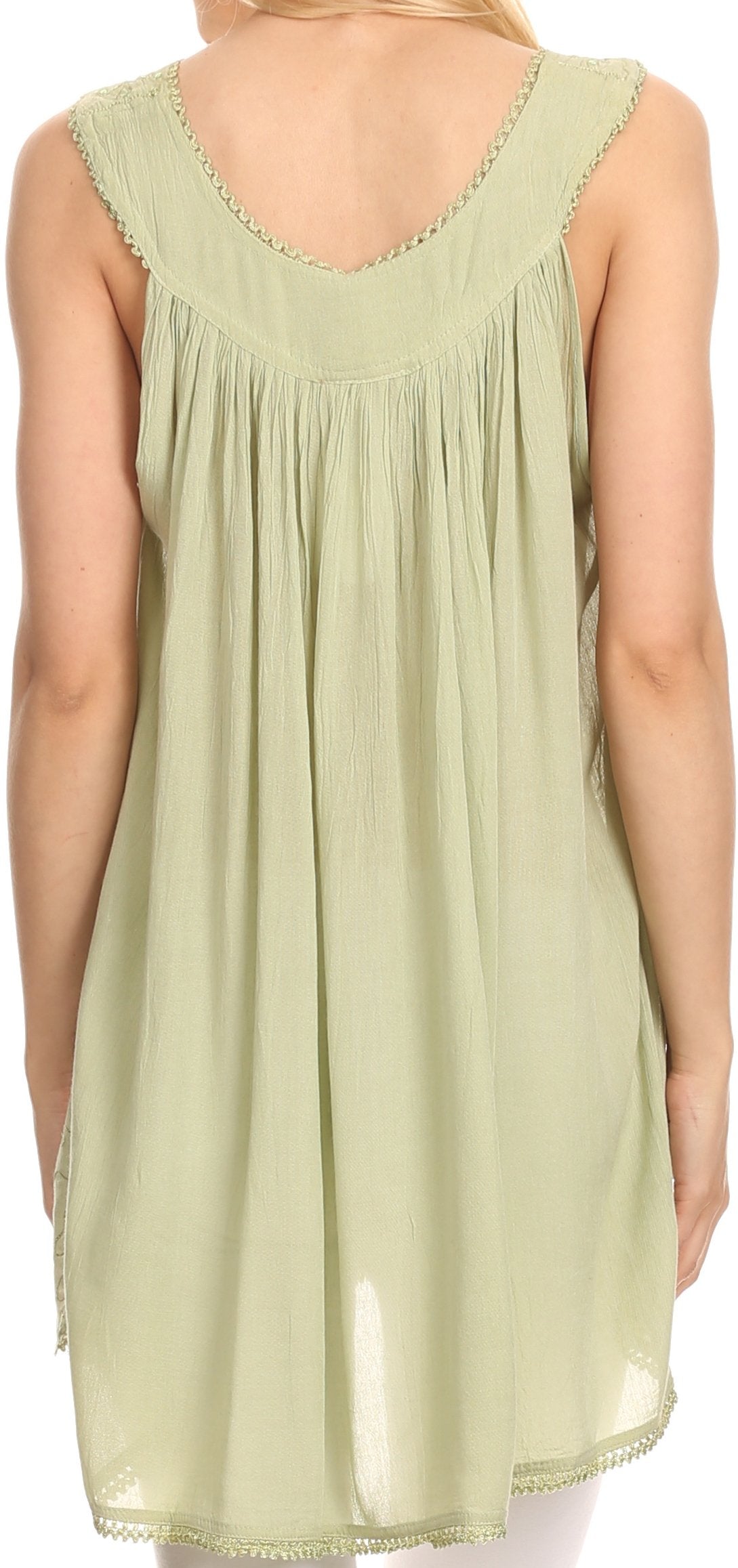 Light green sleeveless top worn by a person on a white background