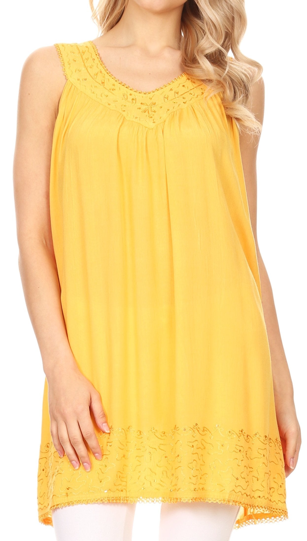 Yellow sleeveless dress with lace details on a white background
