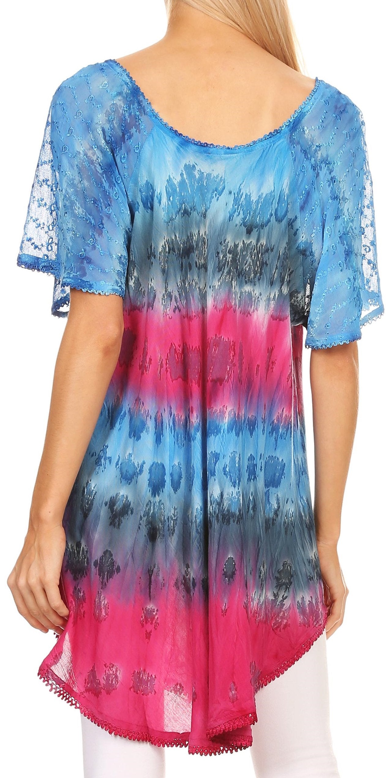 Woman wearing a colorful tie-dye dress with blue, pink, and gray gradient.