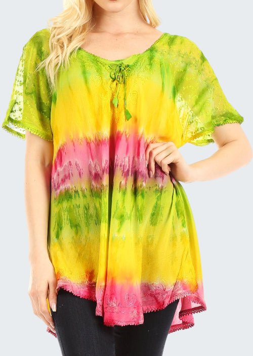 Woman wearing a colorful tie-dye shirt with green, yellow, and pink hues on a white background.