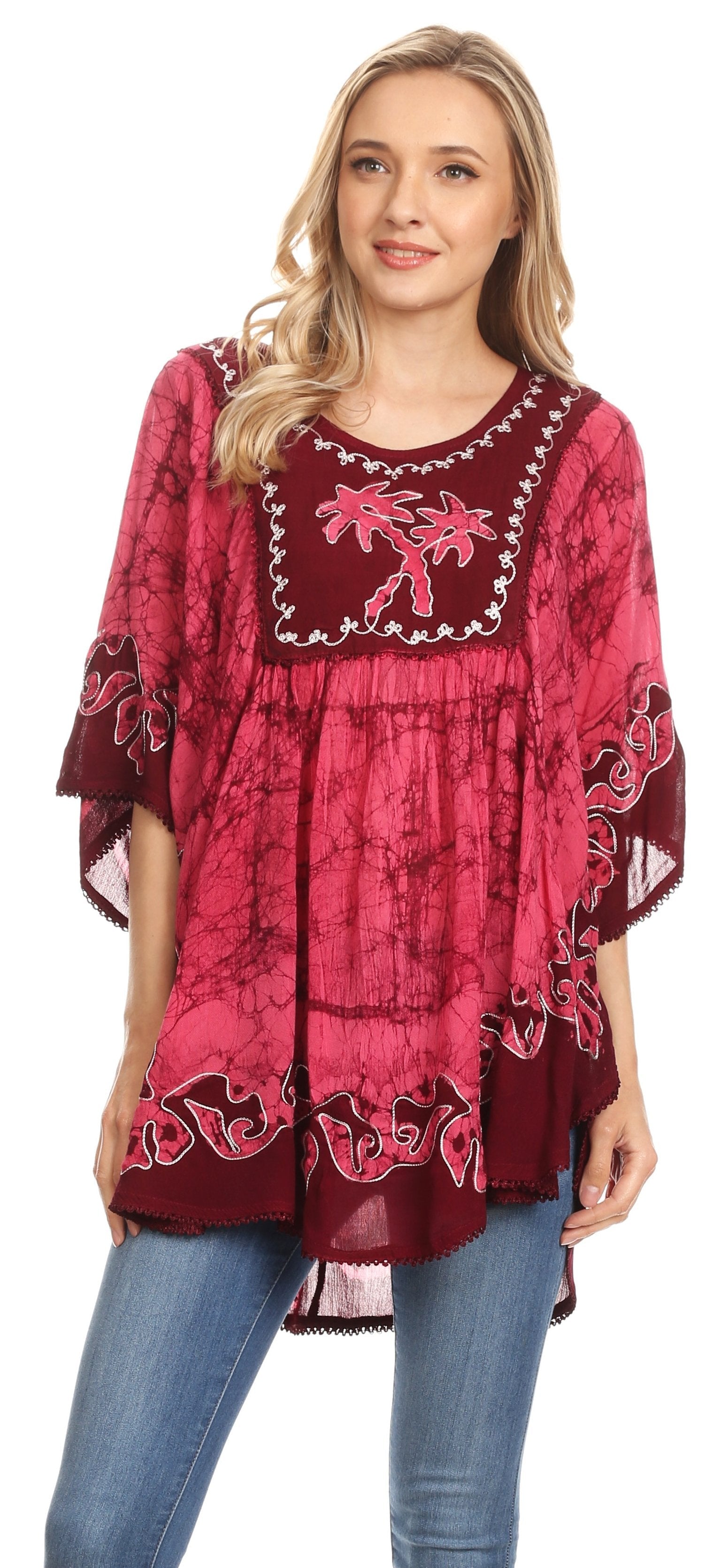 Woman wearing a pink and red patterned dress with a white background