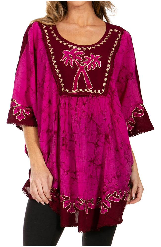 Pink embroidered dress with palm tree design on a white background