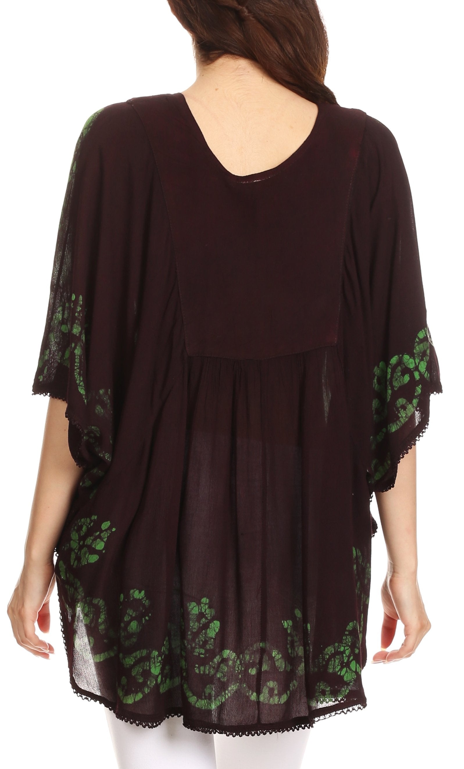 Black dress with green lace details on a white background