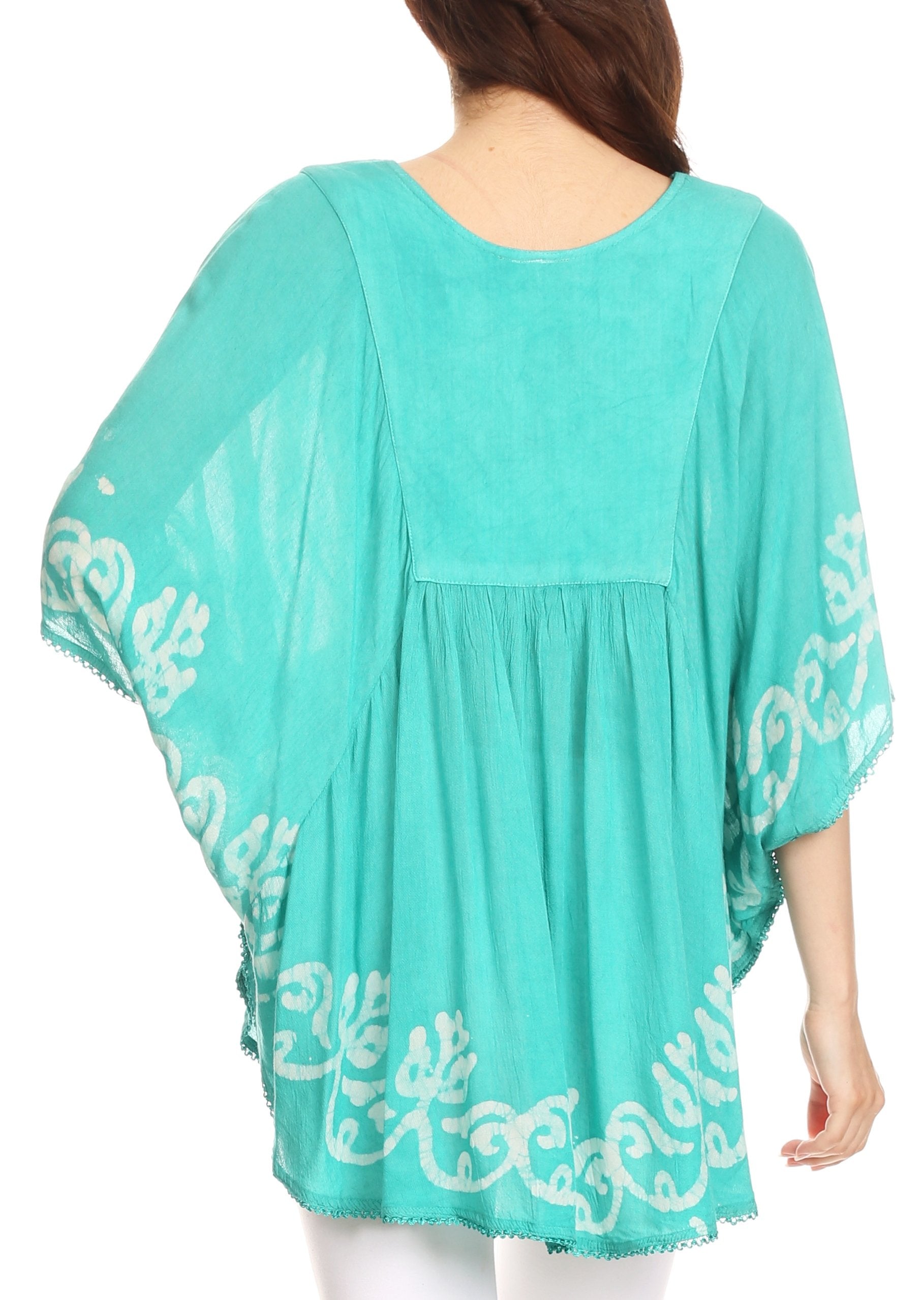 Turquoise dress with white floral embroidery on a white background