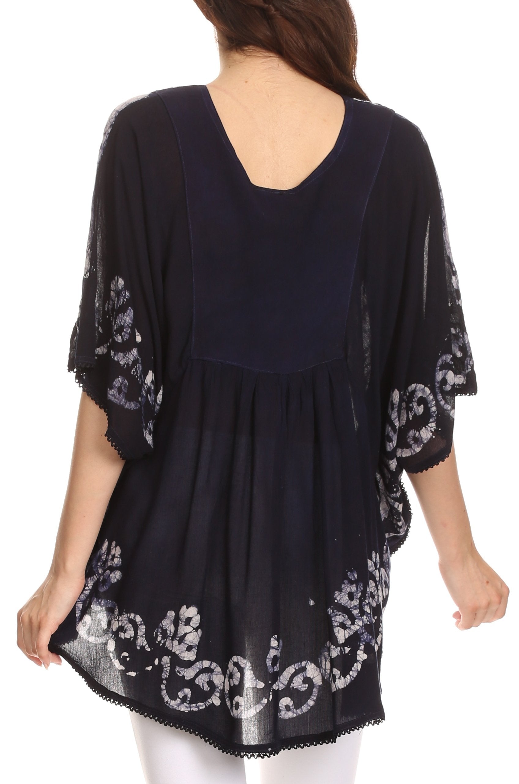 Black embroidered dress worn by a person on a white background