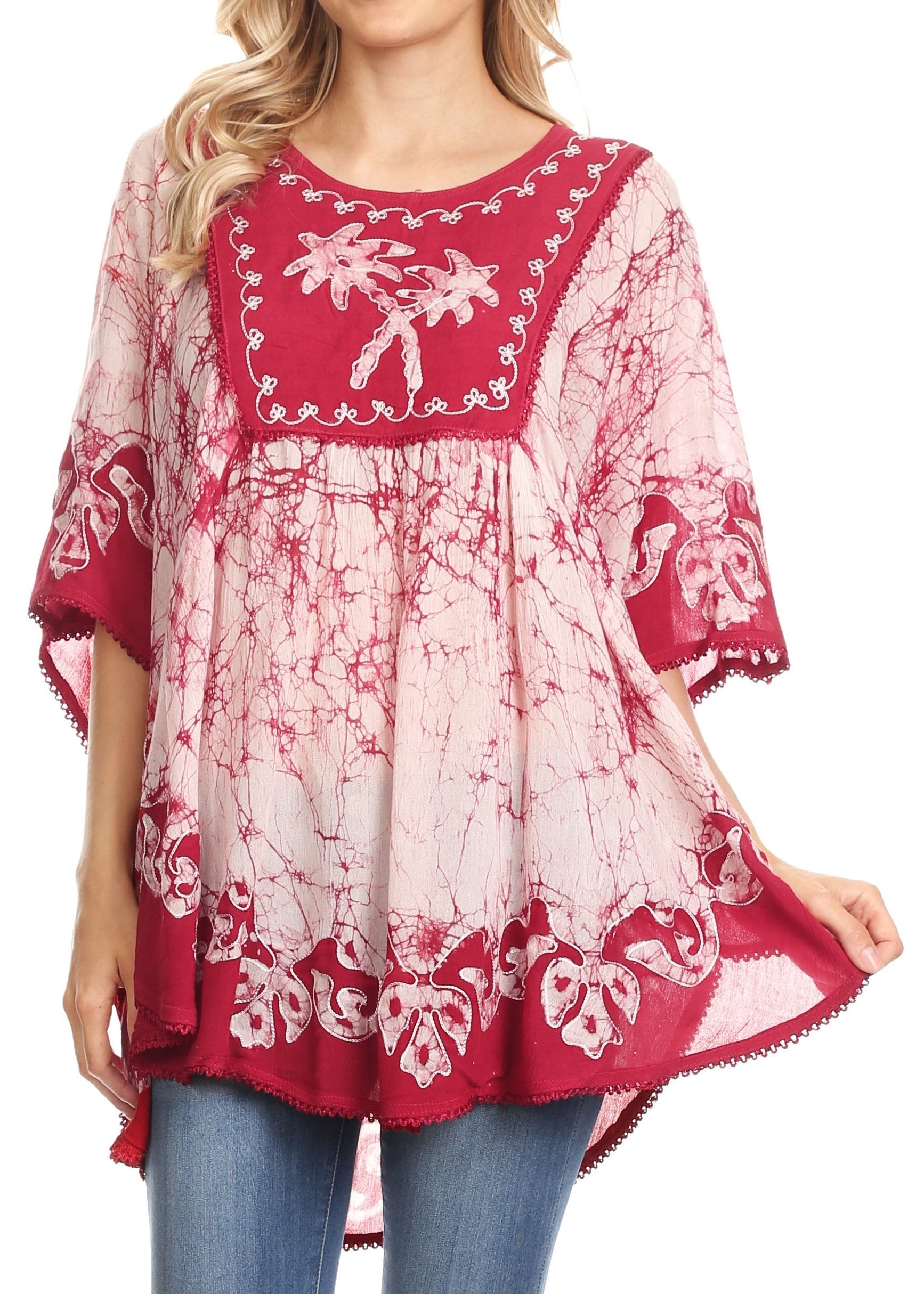 Red and white patterned dress with blue jeans on a white background