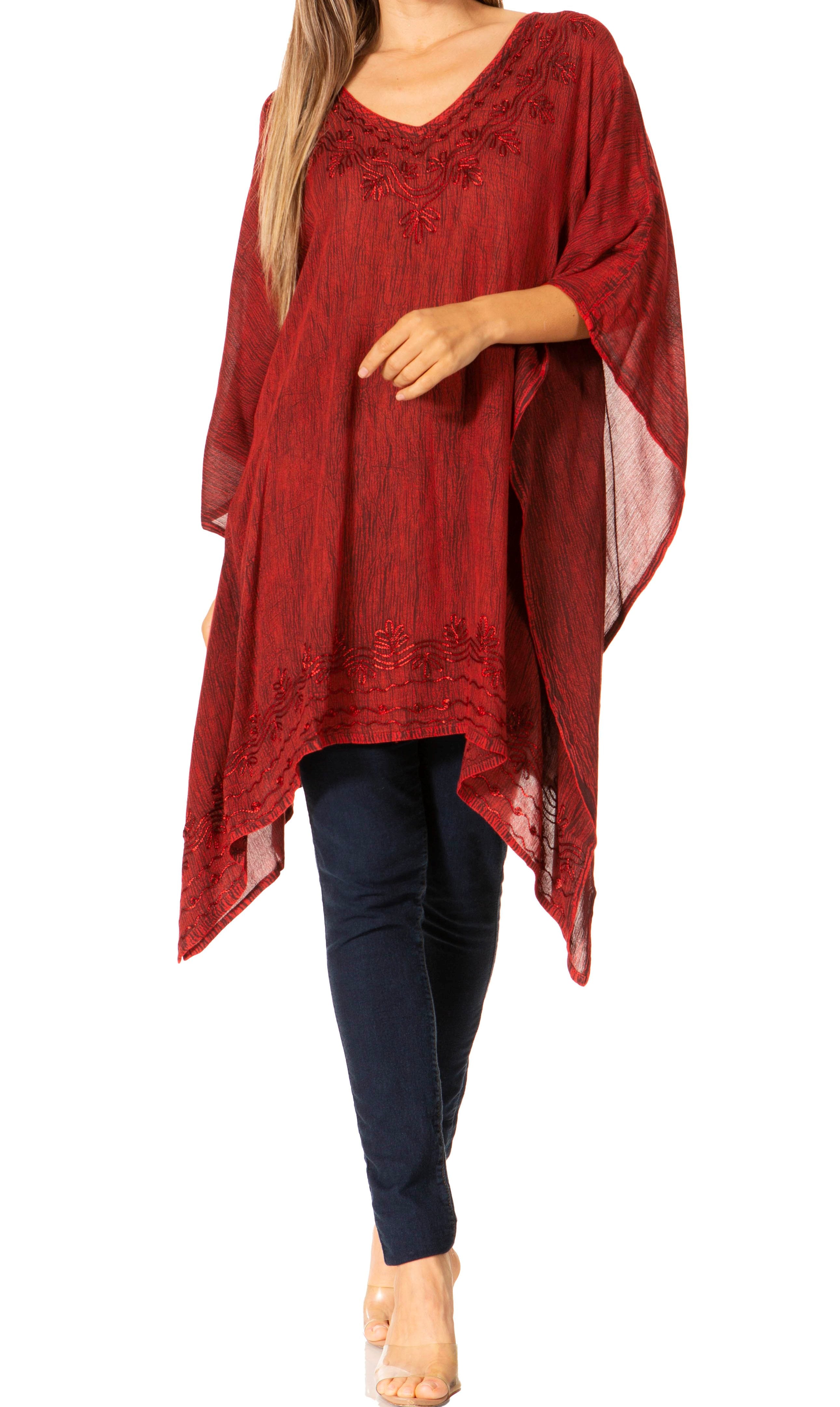 Red patterned top worn by a person on a white background