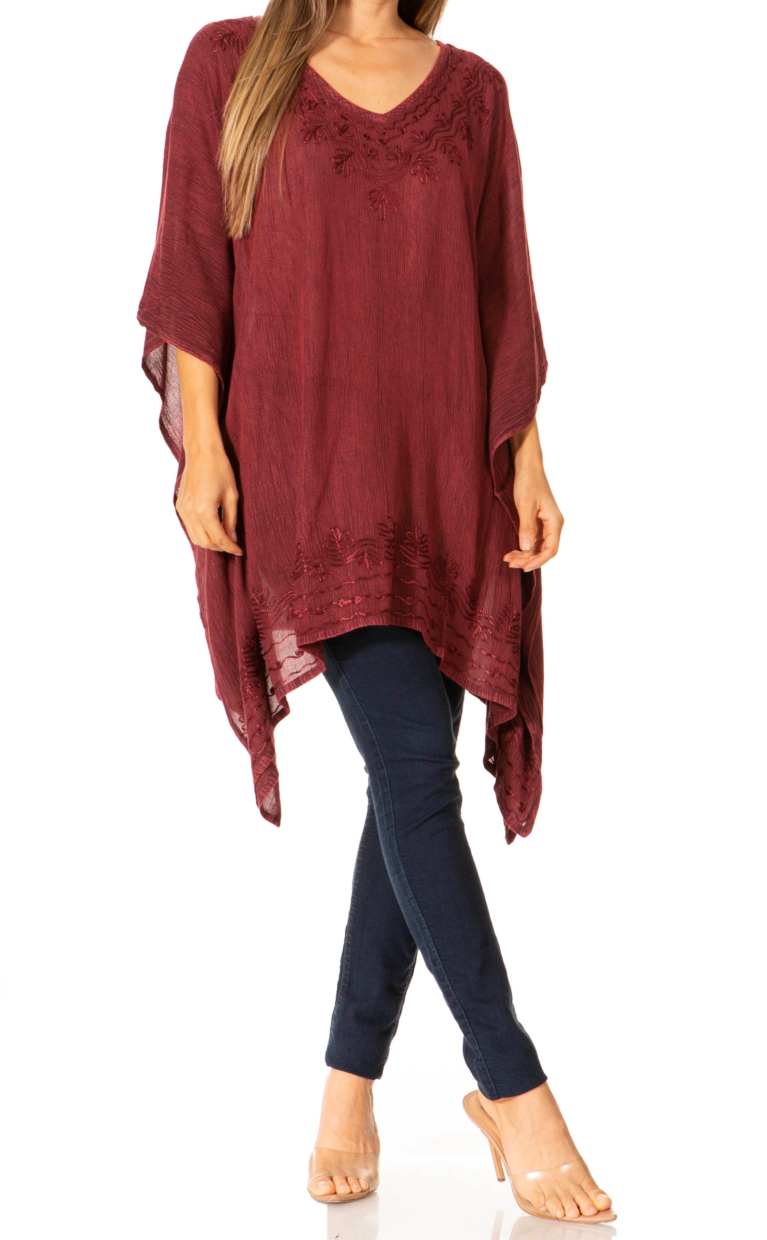 Red poncho over a dark blue outfit on a white background